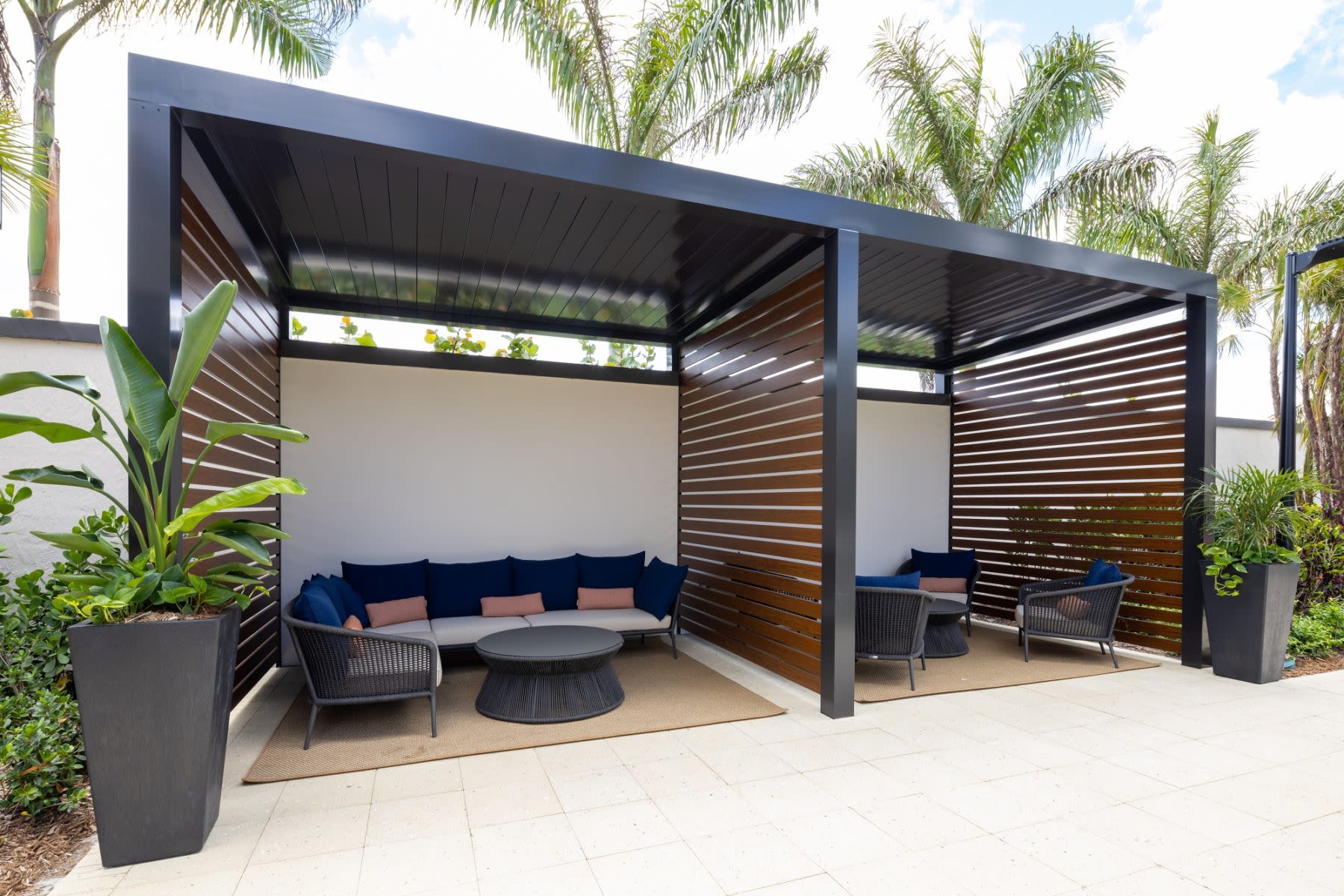 Poolside lounge at Locklyn West Palm in West Palm Beach, Florida