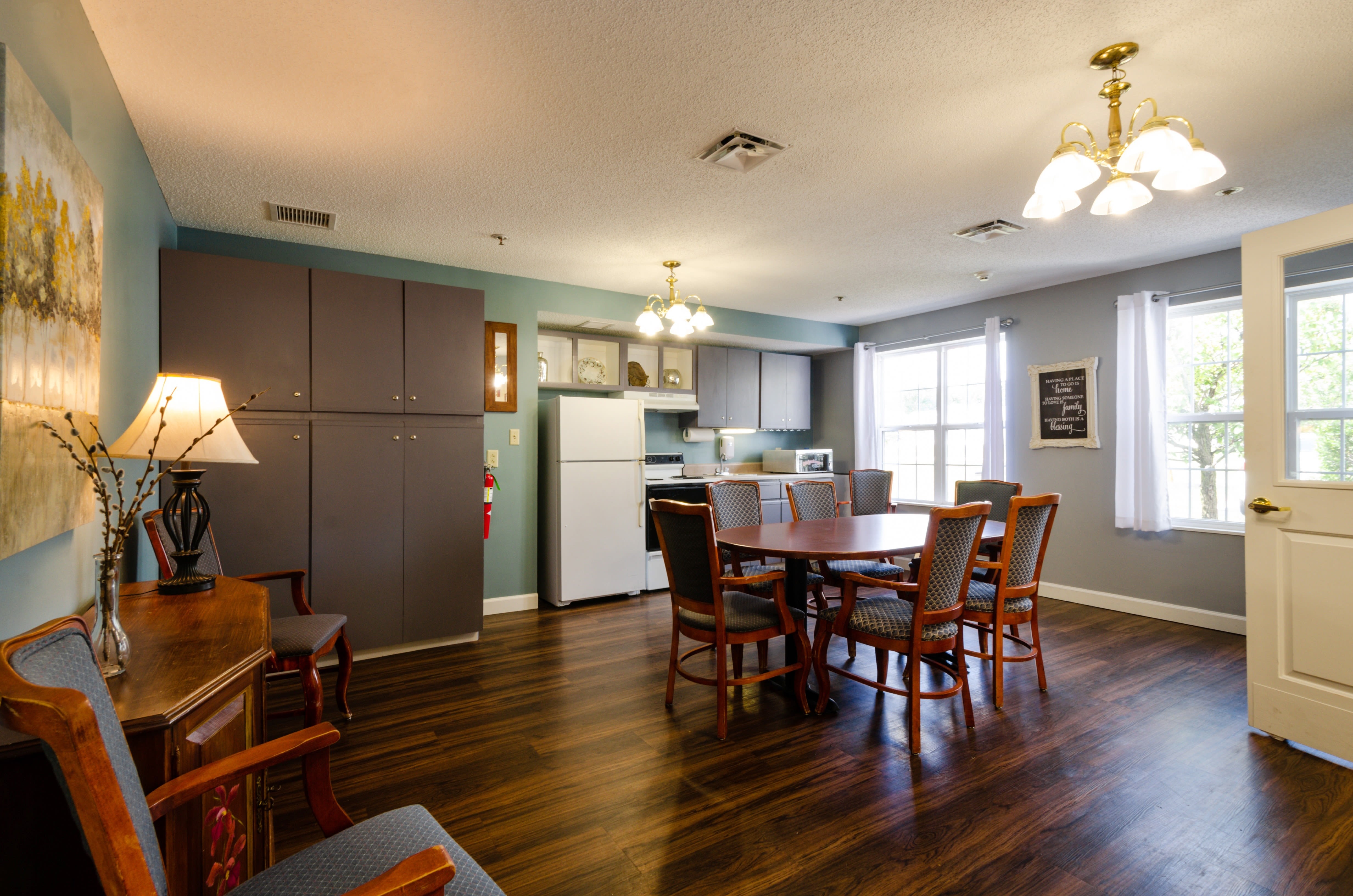 Resident kitchen with hardwood floors and stainless steel appliances at Trustwell Living at Miller Place in Celina, Ohio