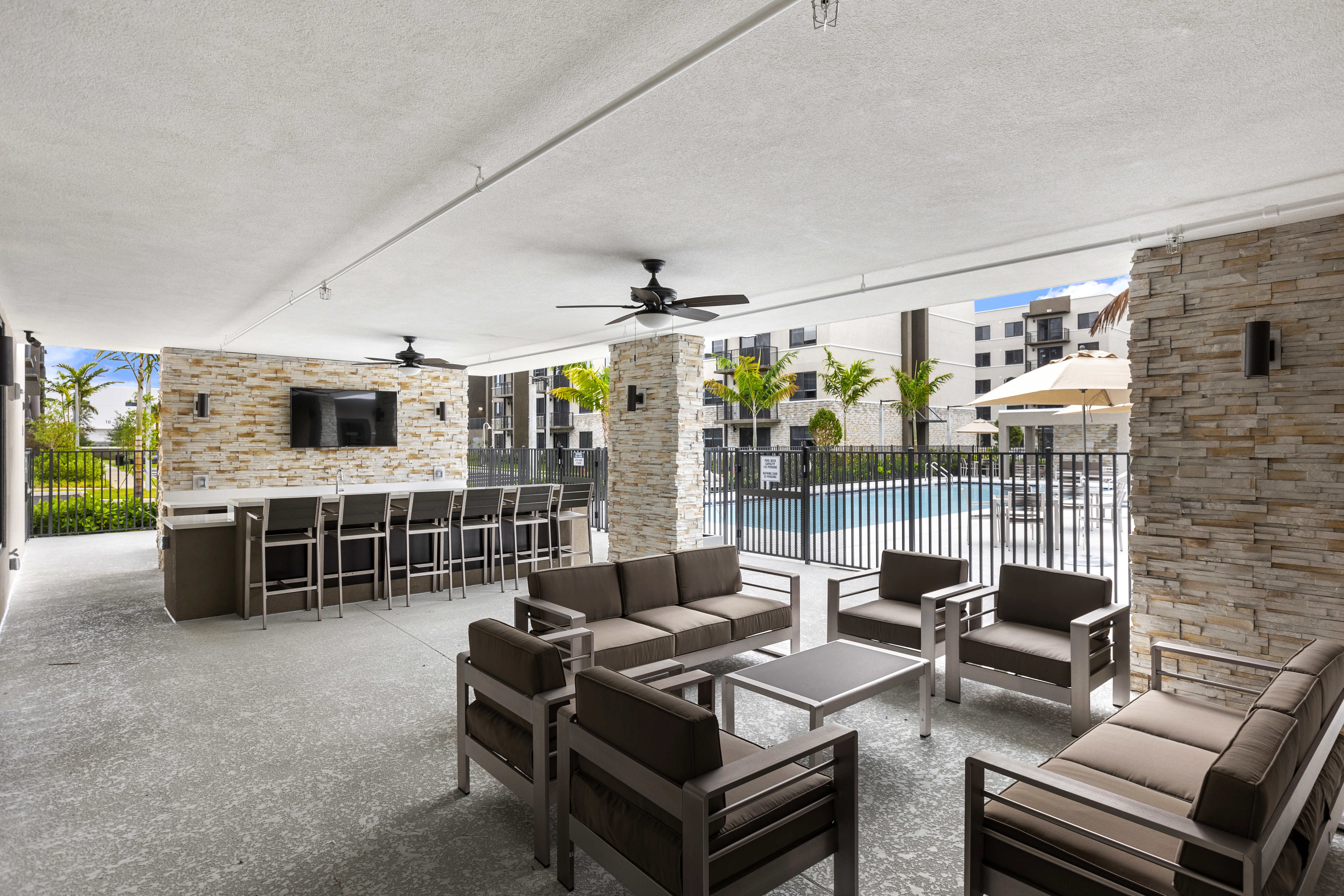 Pool-side lounge seating at Pine Ridge in West Palm Beach, Florida