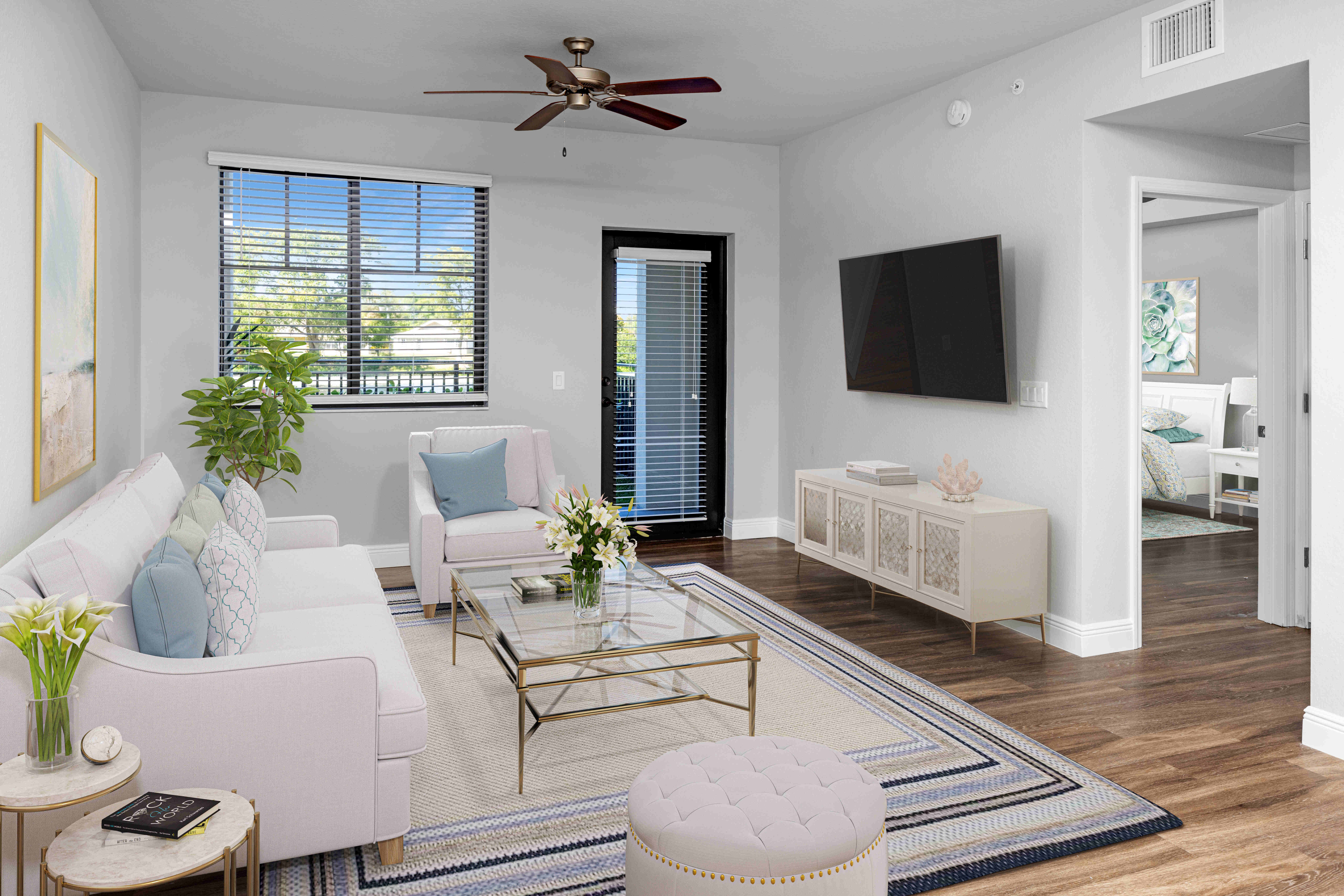Model living room with natural light at Locklyn West Palm in West Palm Beach, Florida