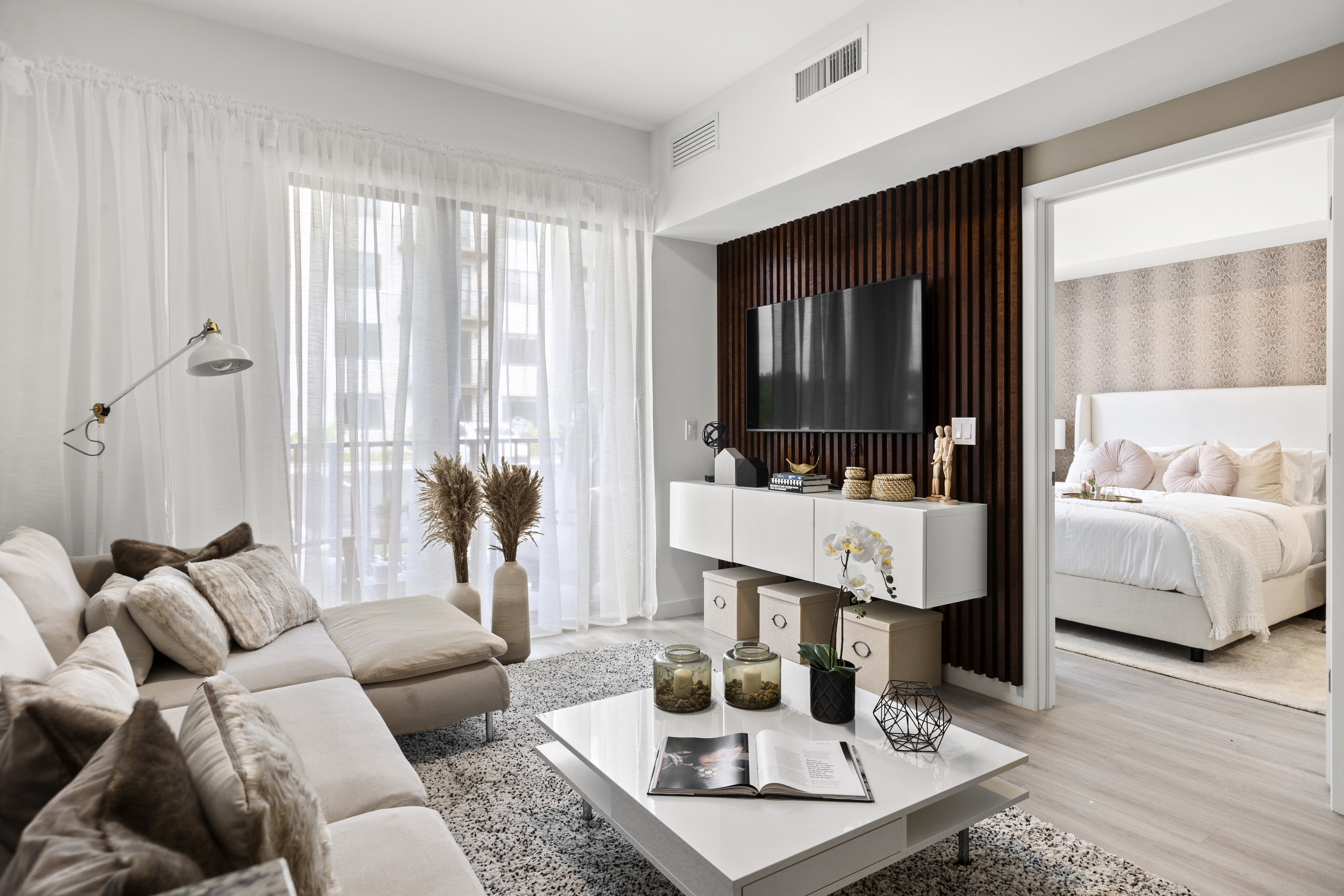 Model living room looking into the bedroom at Pine Ridge in West Palm Beach, Florida
