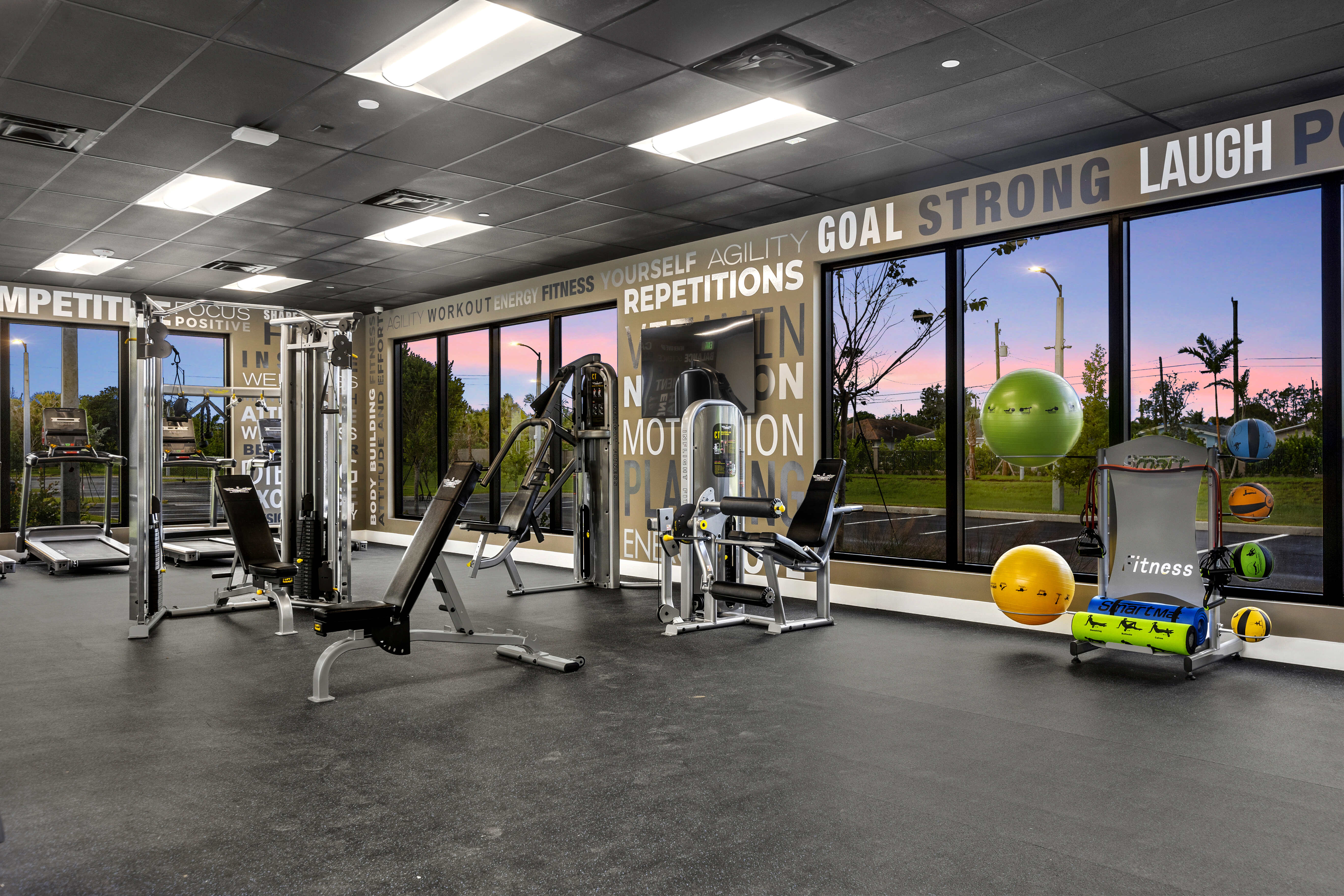 Fitness center with sunset views at Pine Ridge in West Palm Beach, Florida