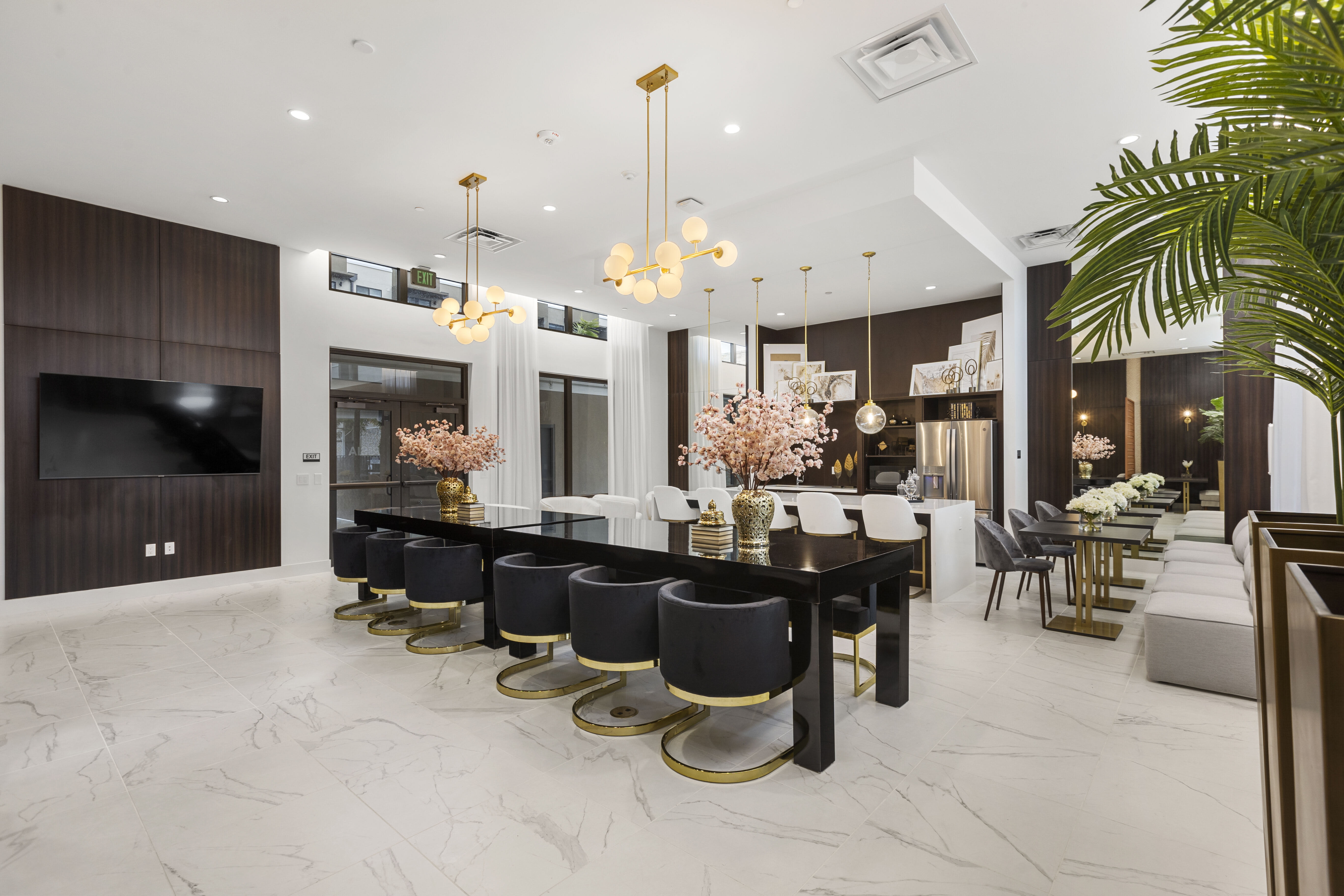 Modern clubhouse offering high-end lighting, comfortable seating, and contemporary furnishings at Pine Ridge, West Palm Beach, Florida