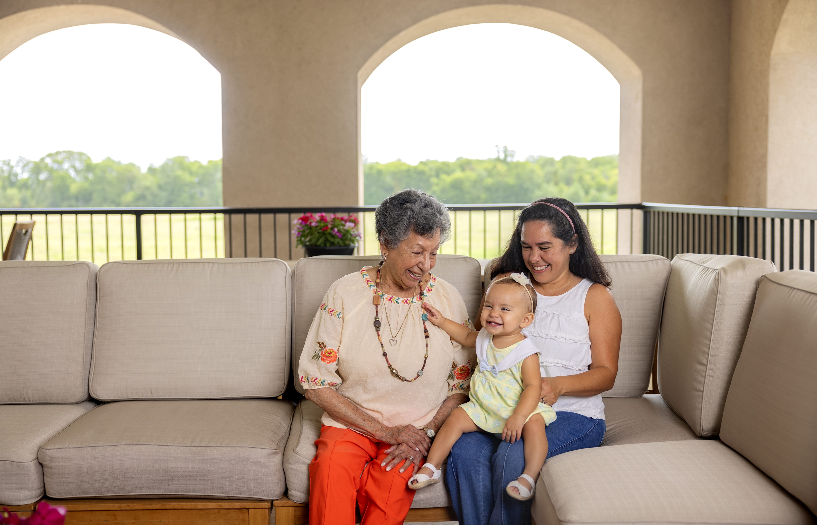 Caretaker resting their hands over the chest of a resident at The Blake at St. Johns in St. Johns, Florida