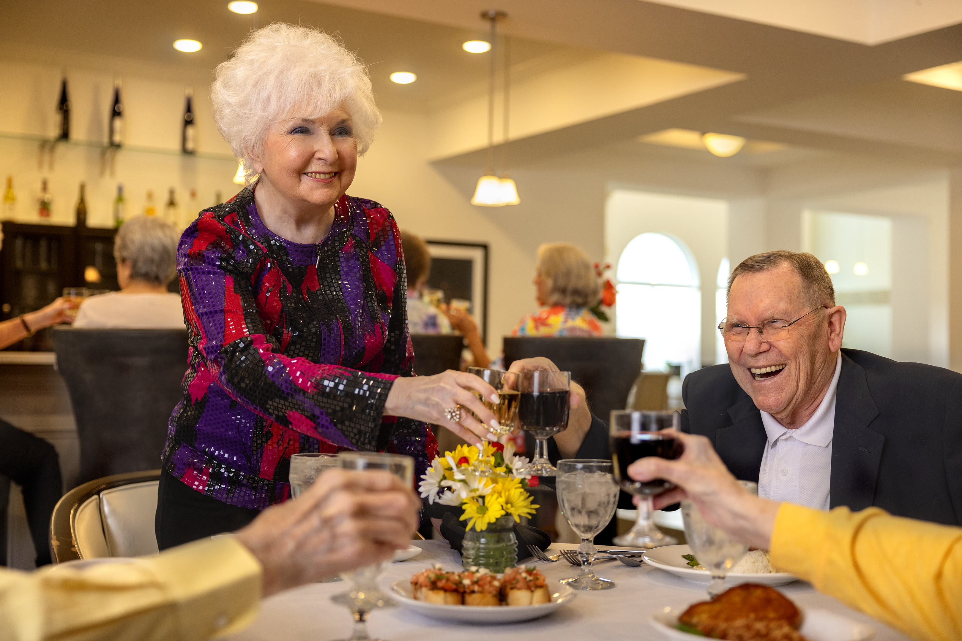 Resident embracing a younger family member at The Blake at Colonial Club in Harahan, Louisiana