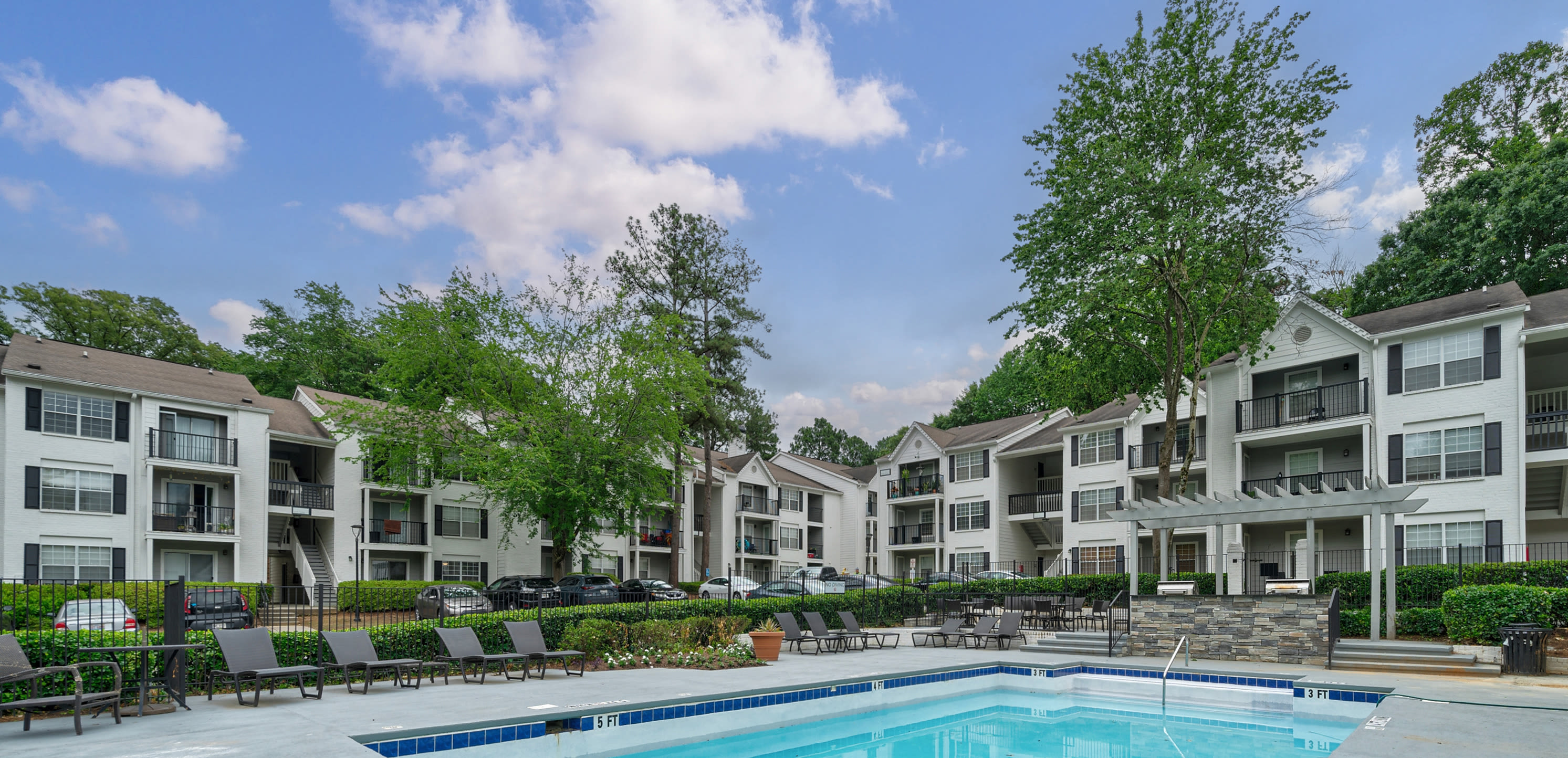 Sparkling swimming pool and sun deck at Castlegate Collier Hills in Atlanta, Georgia