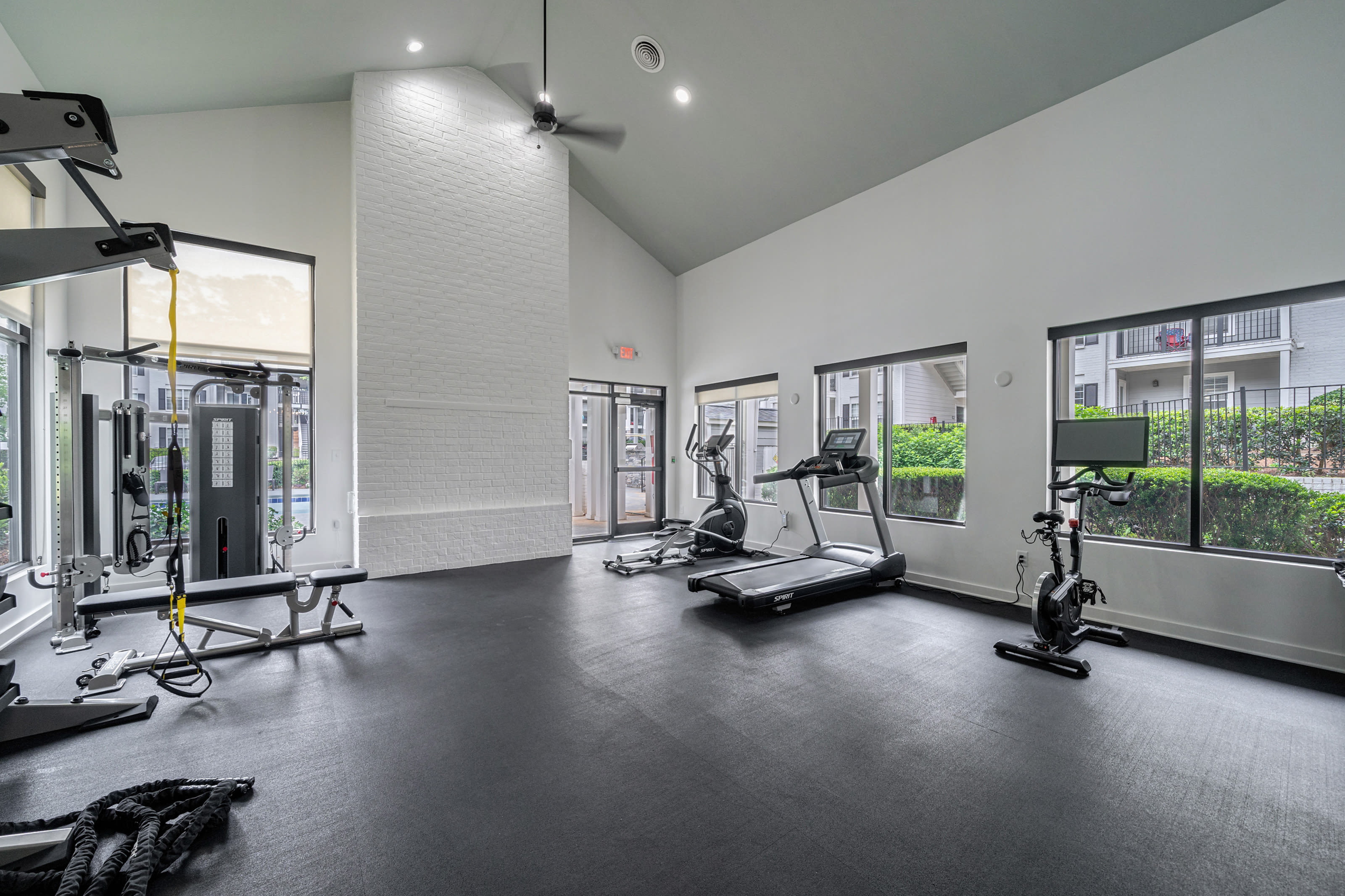 Resident clubhouse with vaulted ceilings and a fireplace at Castlegate Collier Hills in Atlanta, Georgia