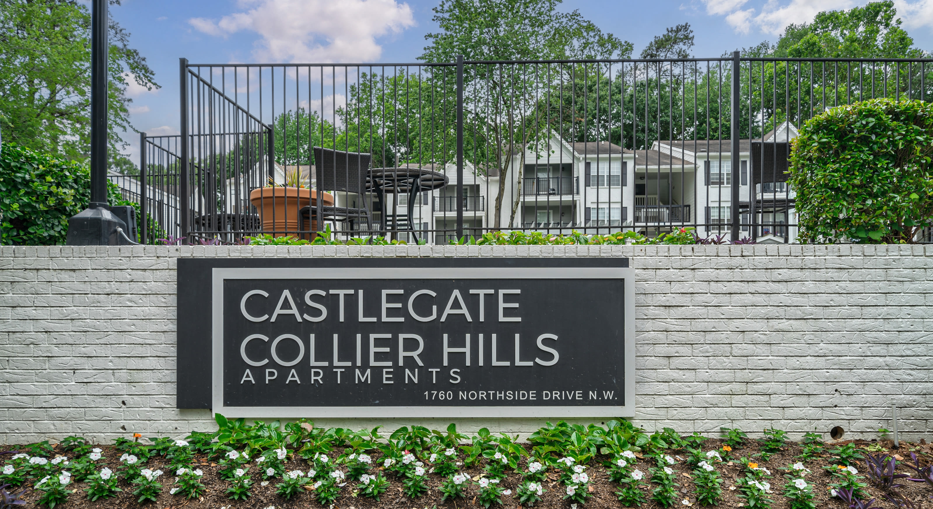 Exterior with a walking path at Castlegate Collier Hills in Atlanta, Georgia