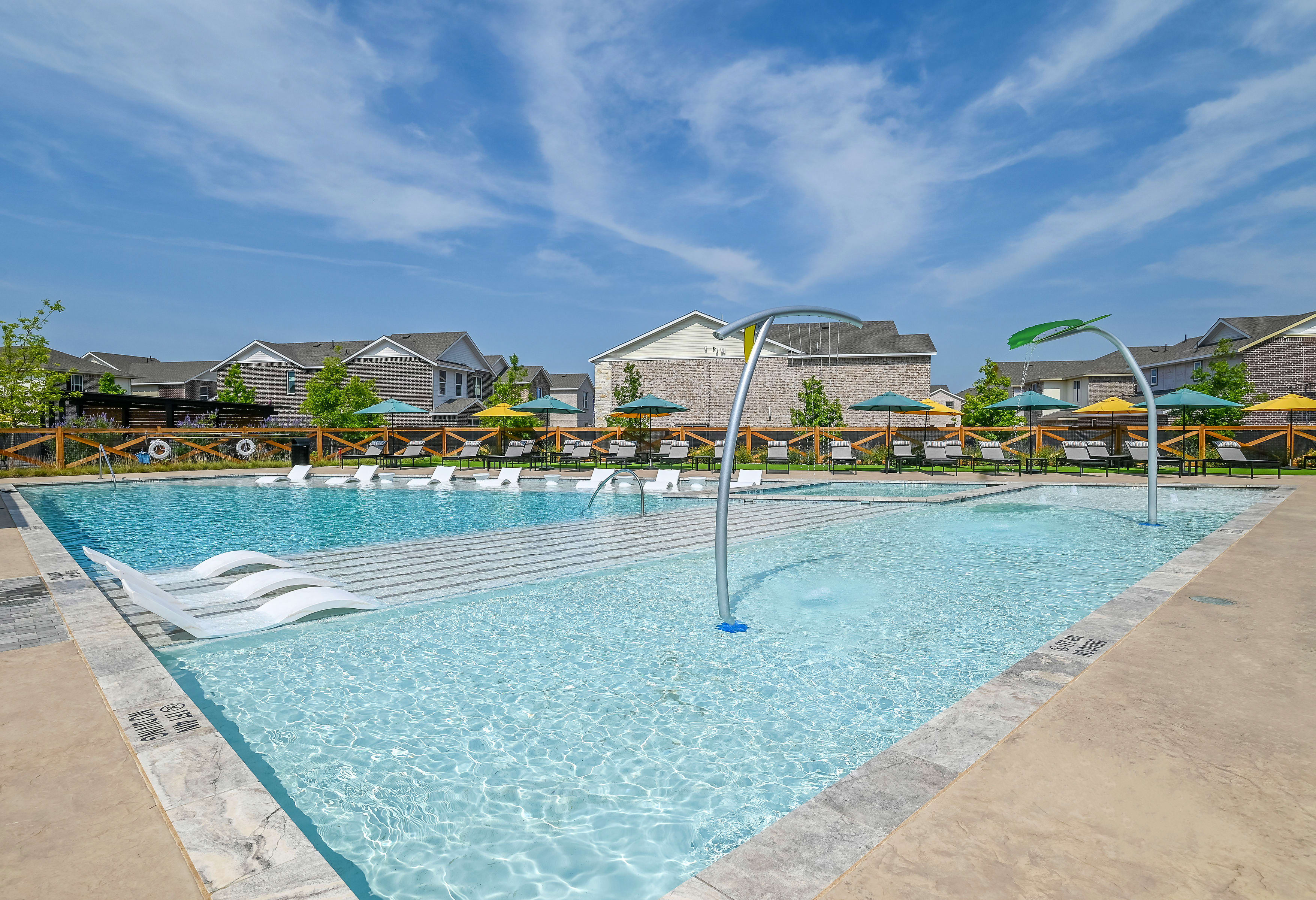 Gorgeous resort style swimming pool at BB Living Light Farms in Celina, Texas