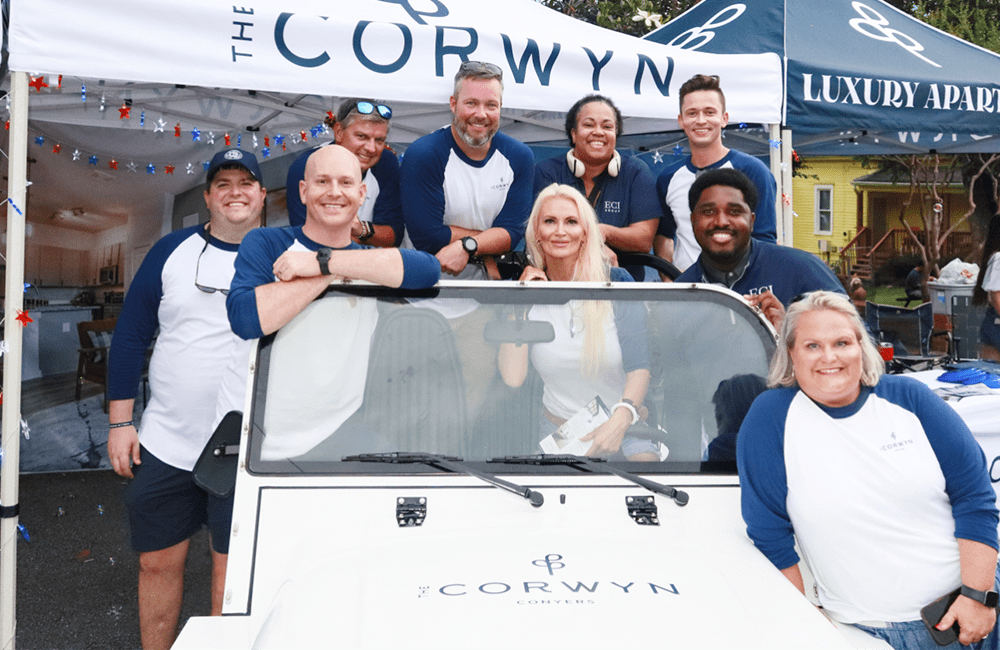 The team at Corwyn Conyers sitting in a utility vehicle at an Olde Town Conyers holiday event