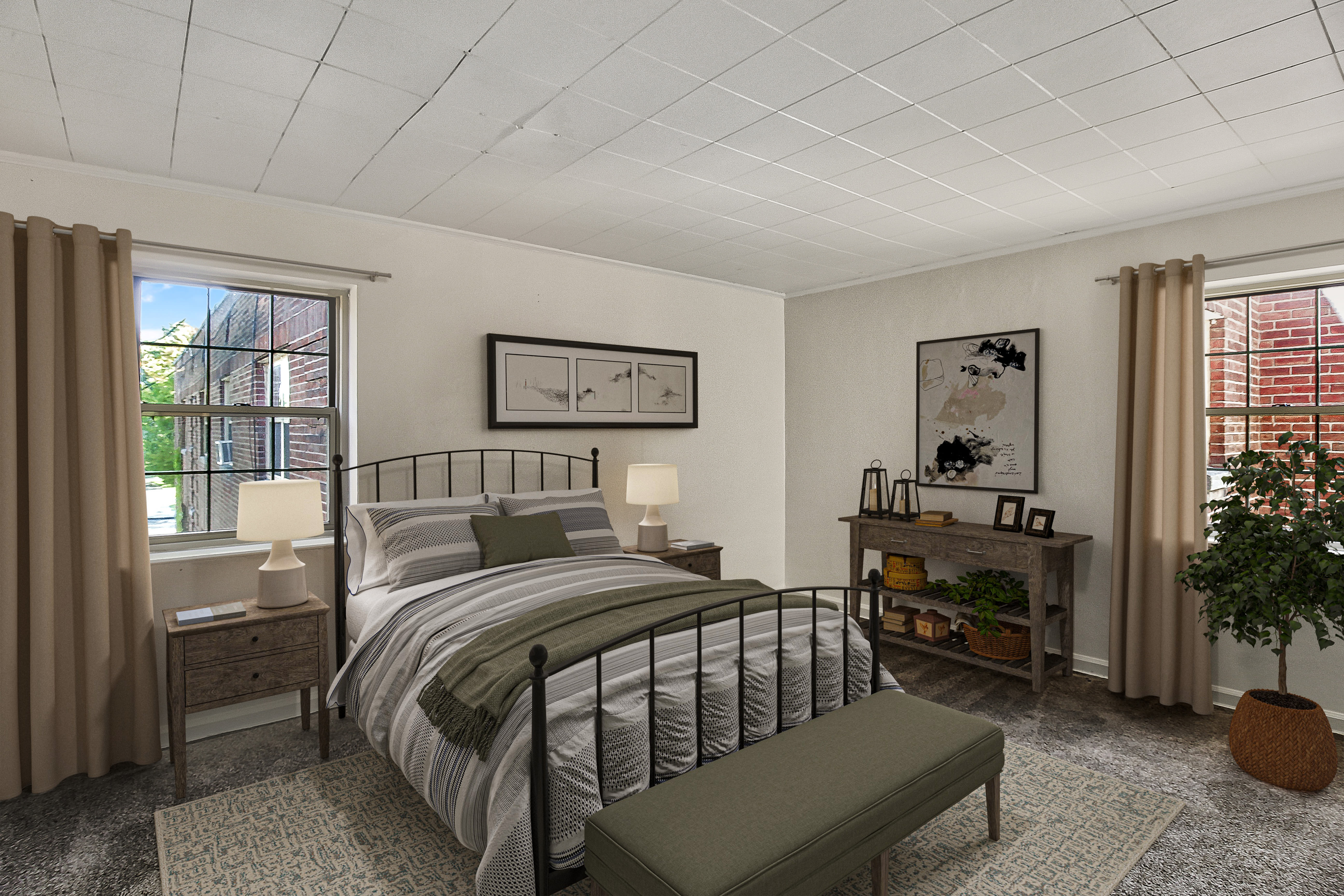 Spacious model bedroom with hardwood-style flooring at Brighton Gardens in Rochester, New York