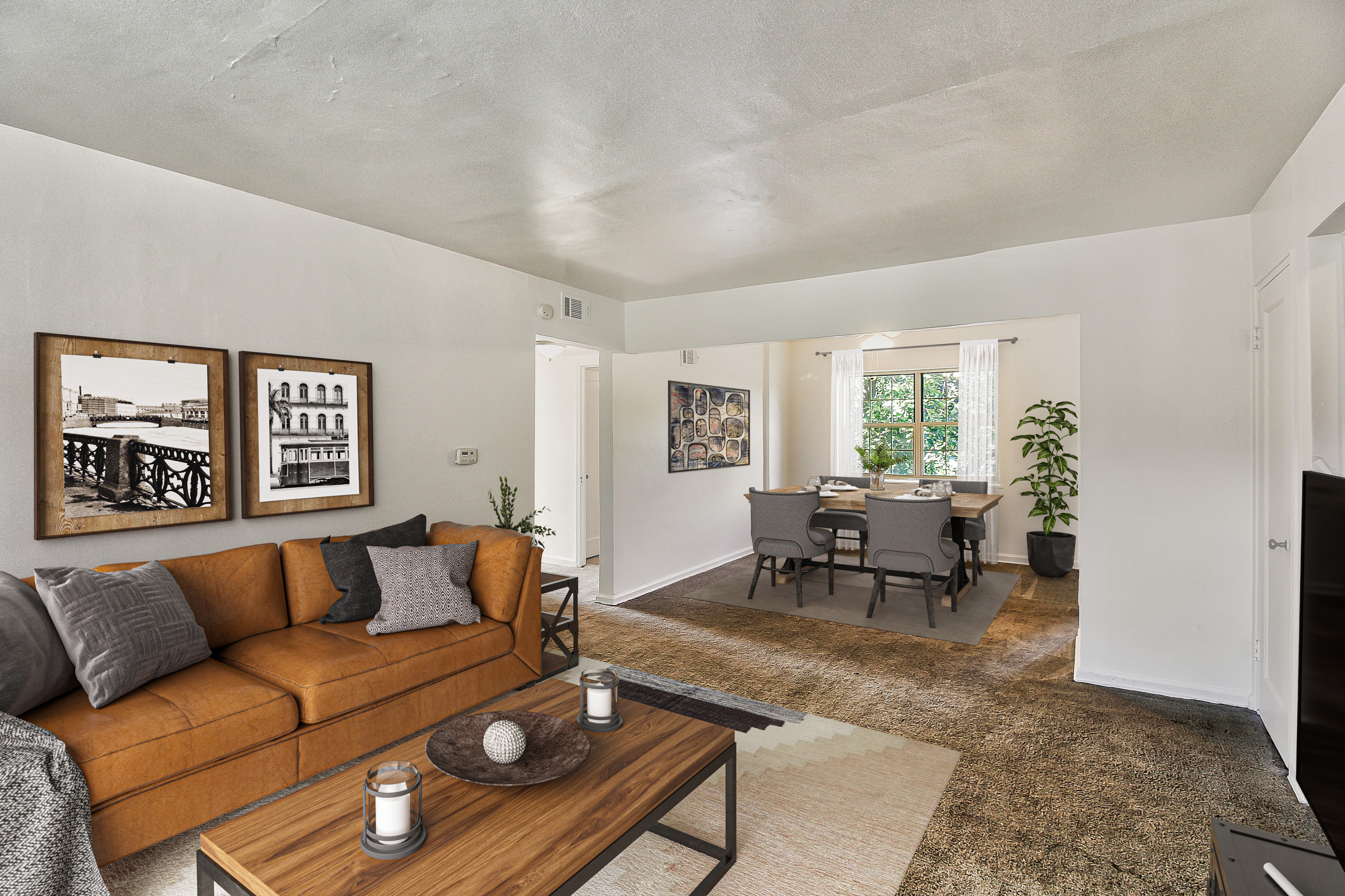 Open layout model home with hardwood-style flooring at Brighton Gardens in Rochester, New York