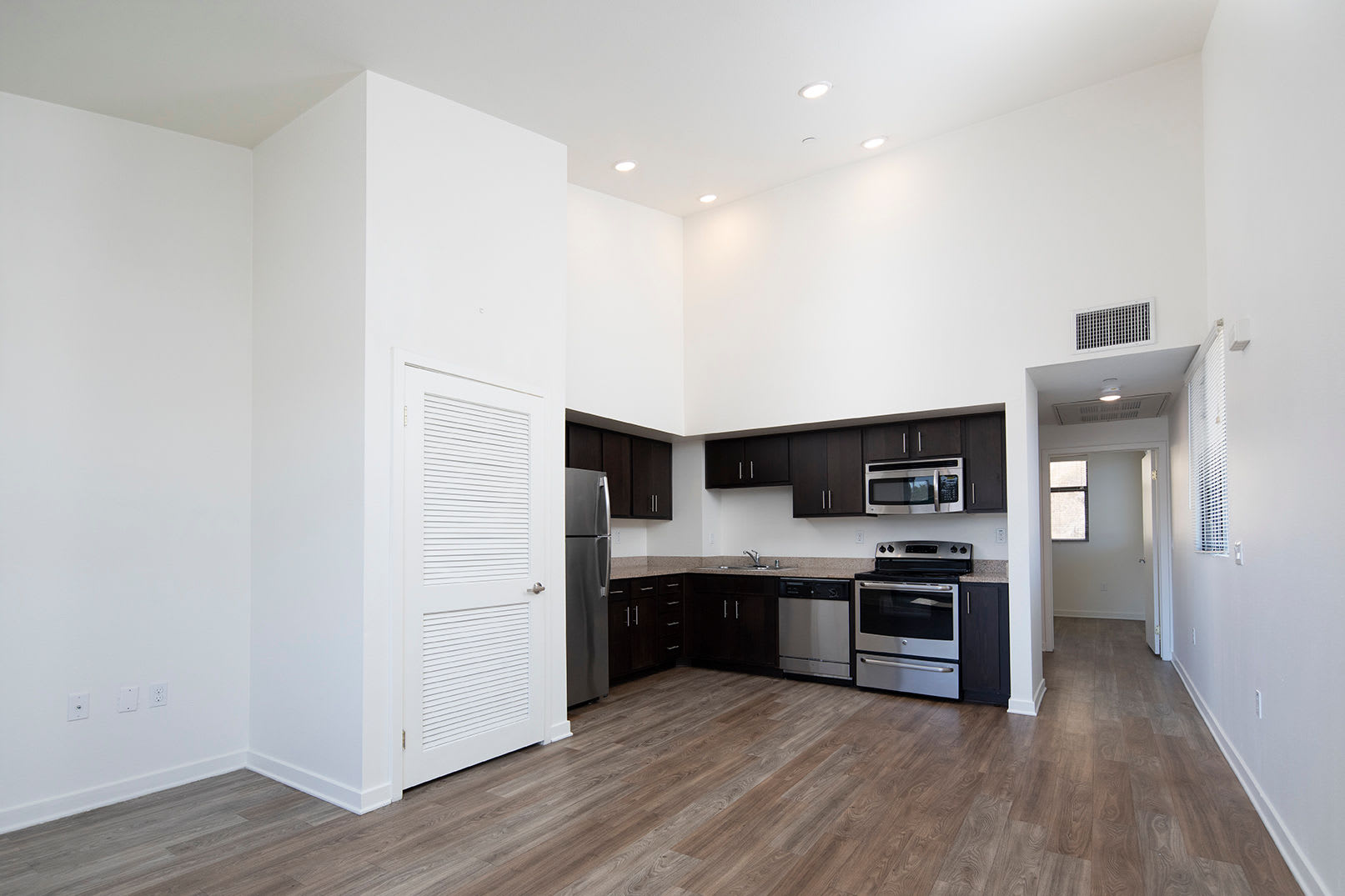 Modern kitchen in a model home's living space at The Quarry Apartments in La Mesa, California