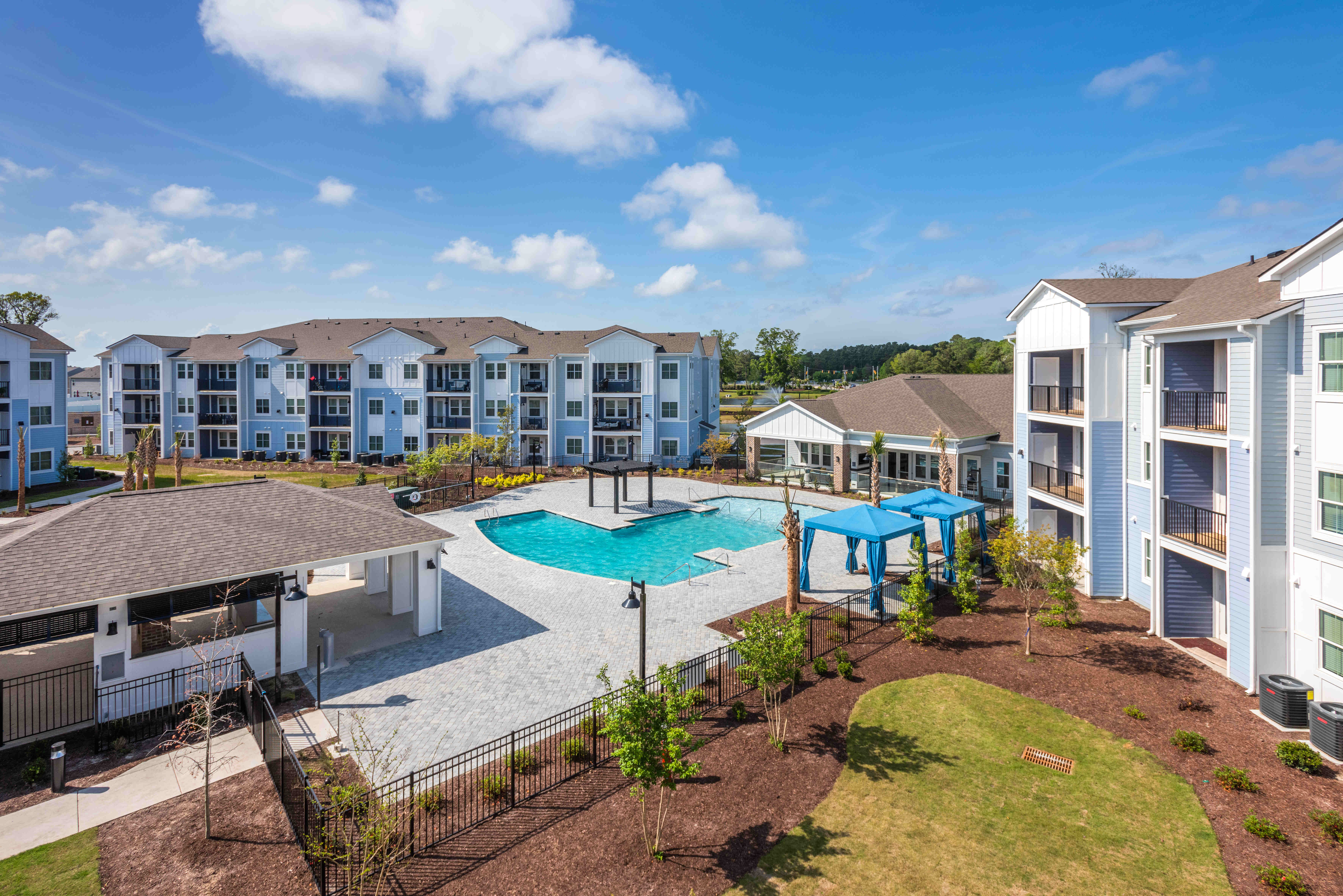 Arial view of a swimming pool and the apartments at Artisan Carolina Forest in Myrtle Beach, South Carolina