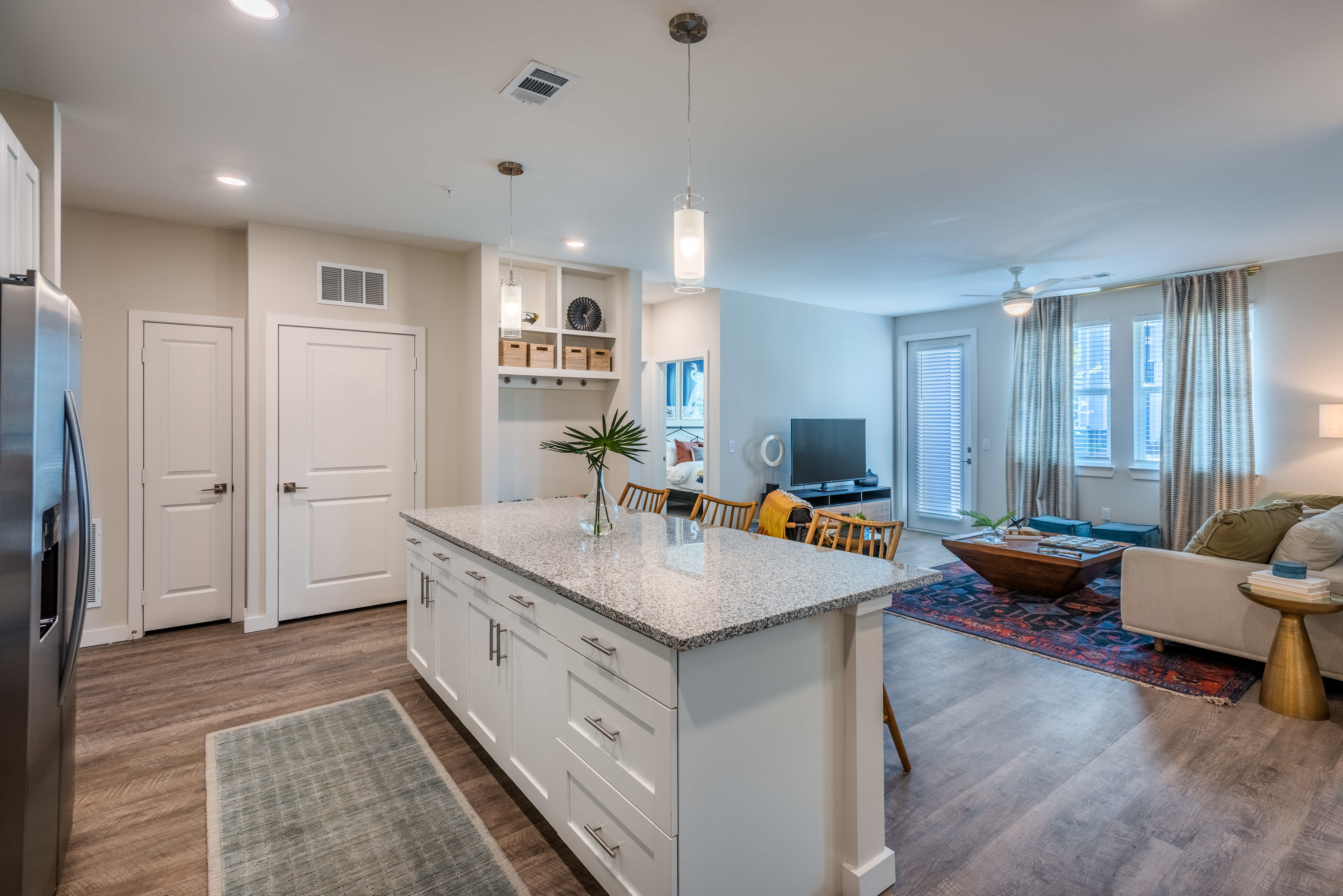 Well-lit kitchen and living room at Artisan Carolina Forest in Myrtle Beach