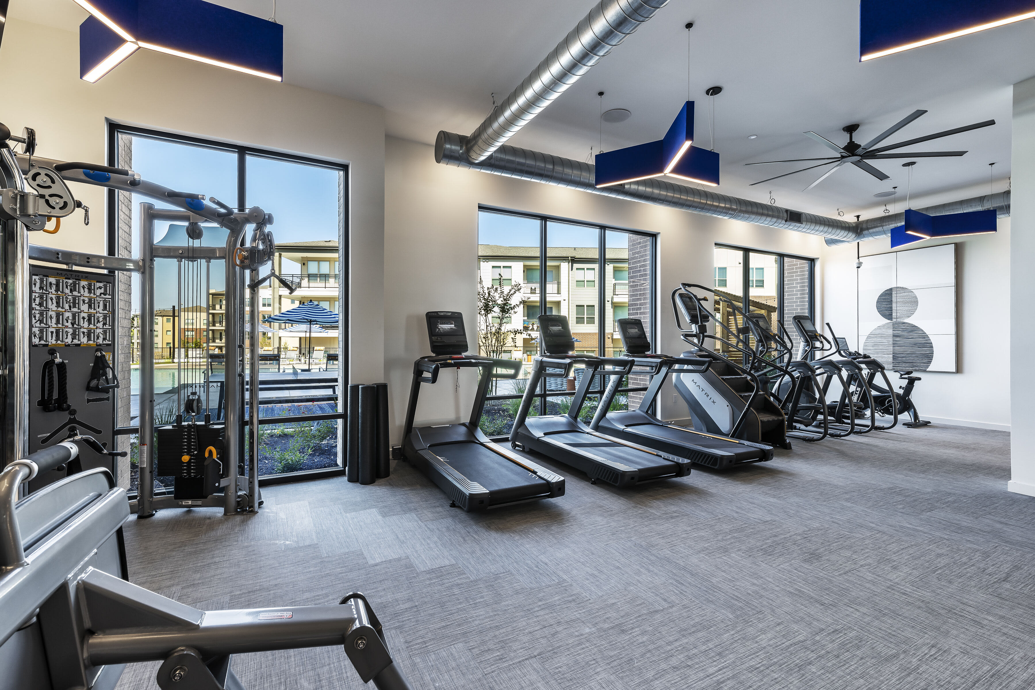 Large fitness center with cardio e at The Warner in Round Rock, Texas