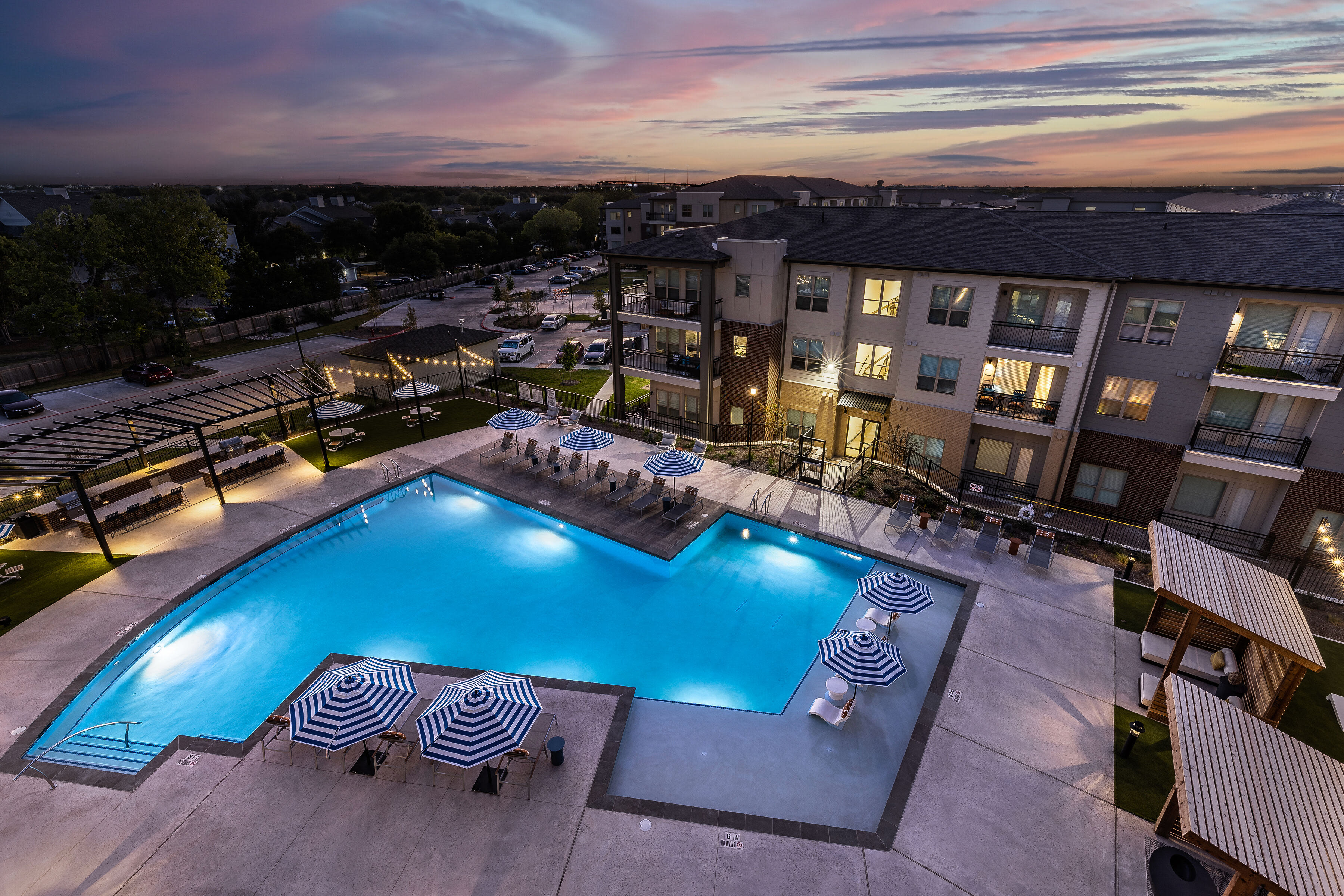 Arial view of the pool at night at The Warner in Round Rock, Texas