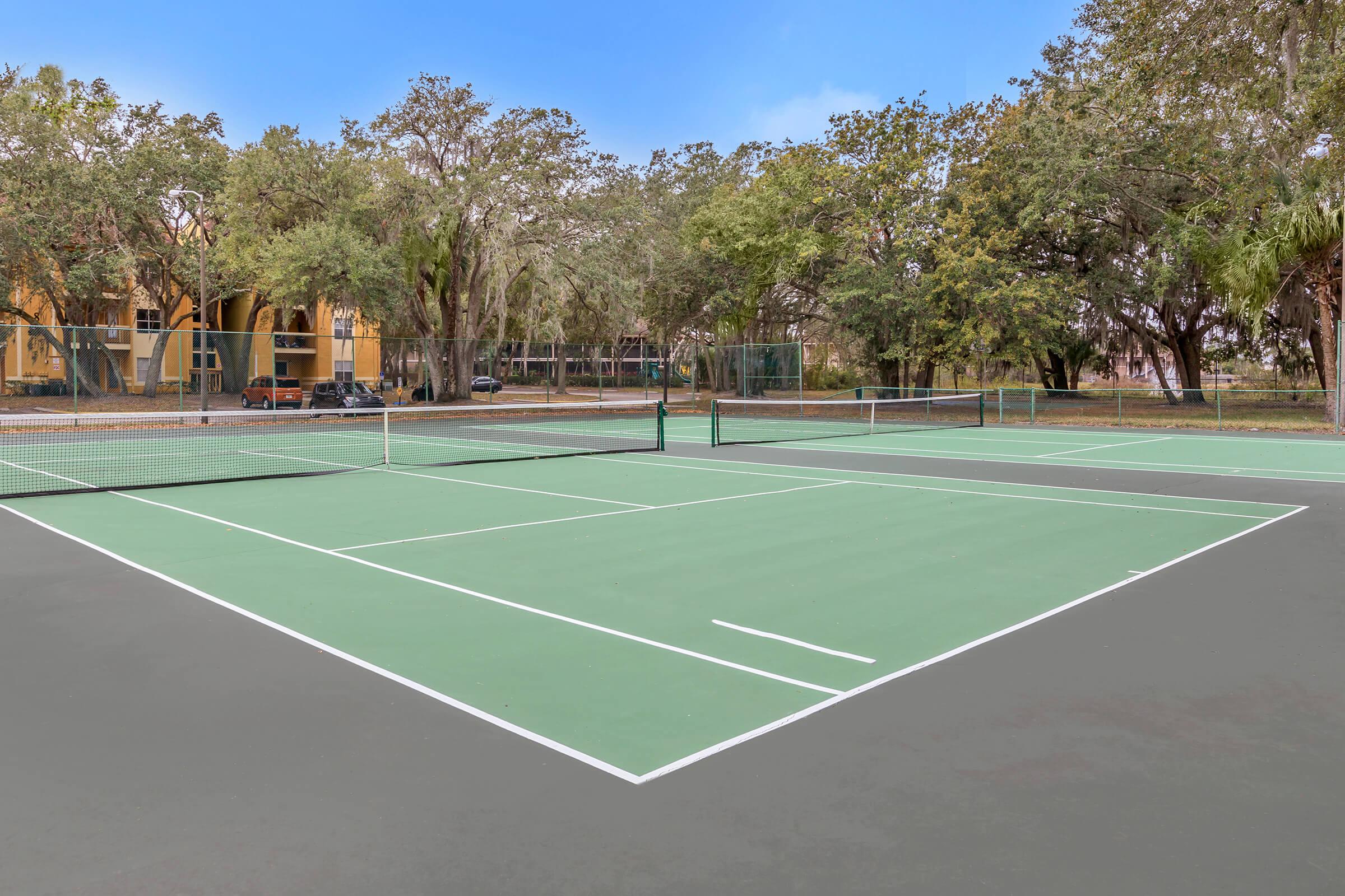 View amenities like our tennis court at Kissimmee, Florida