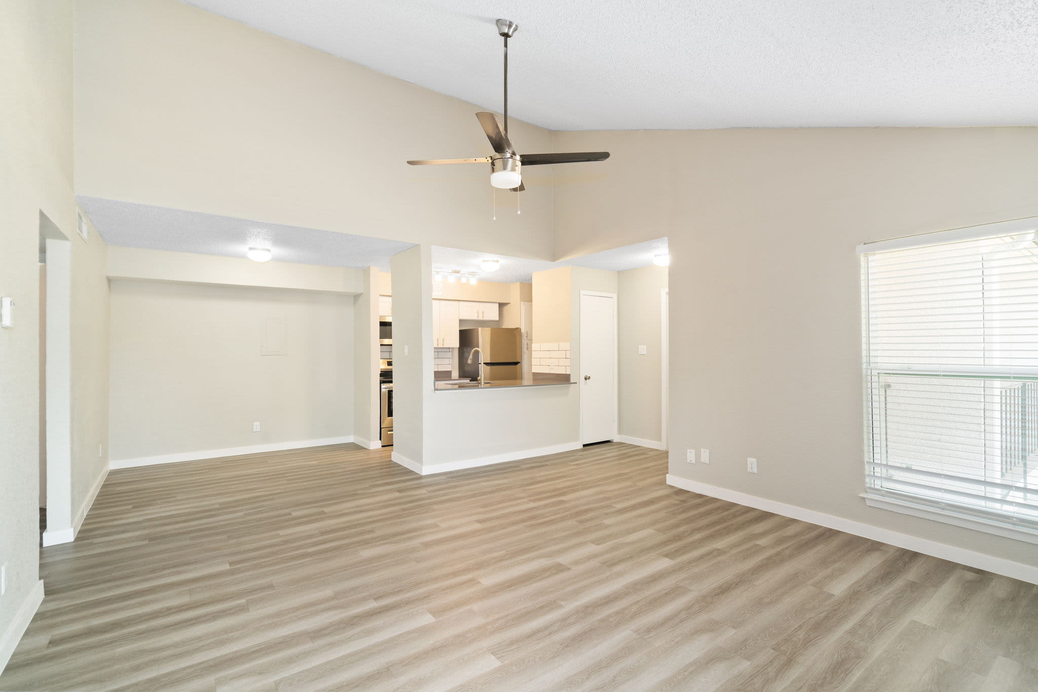 Kitchen with wood-style flooring at Tides on Avril in Fort Worth, Texas