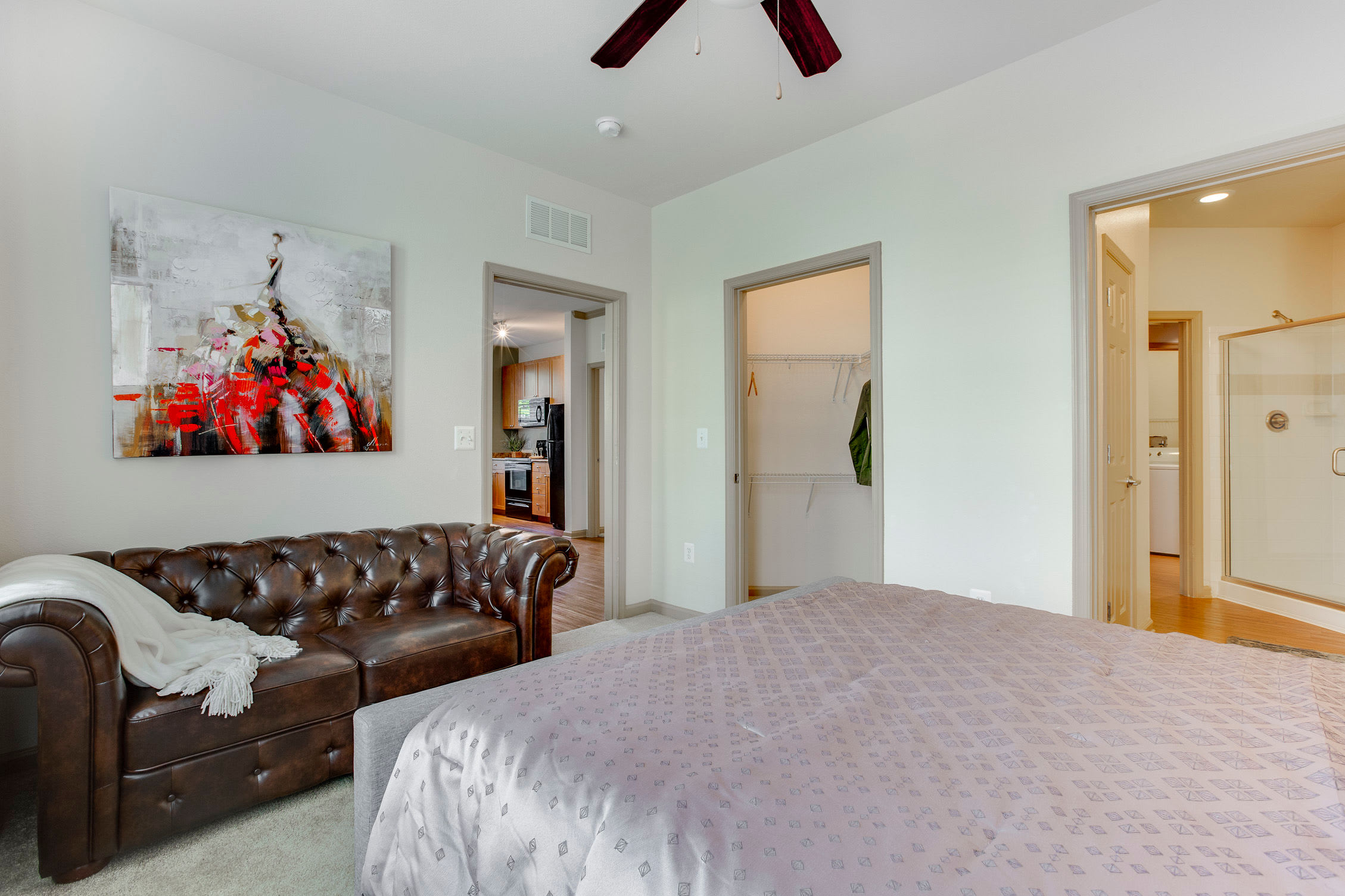Bedroom with a couch at Summerfield at Morgan Metro in Hyattsville, Maryland