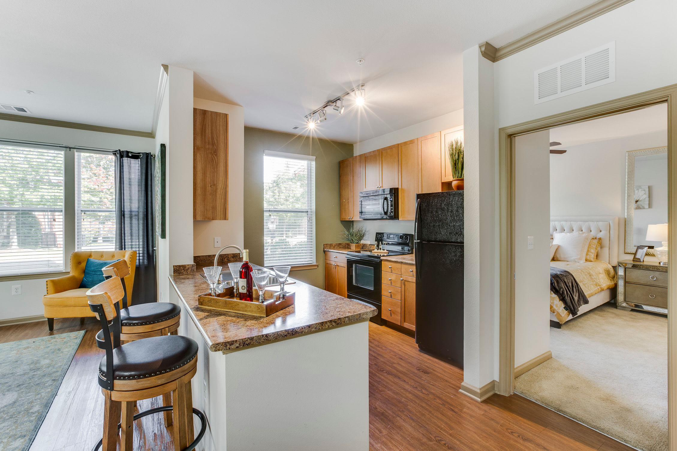 View of the kitchen island next to the bedroom at Summerfield at Morgan Metro in Hyattsville, Maryland
