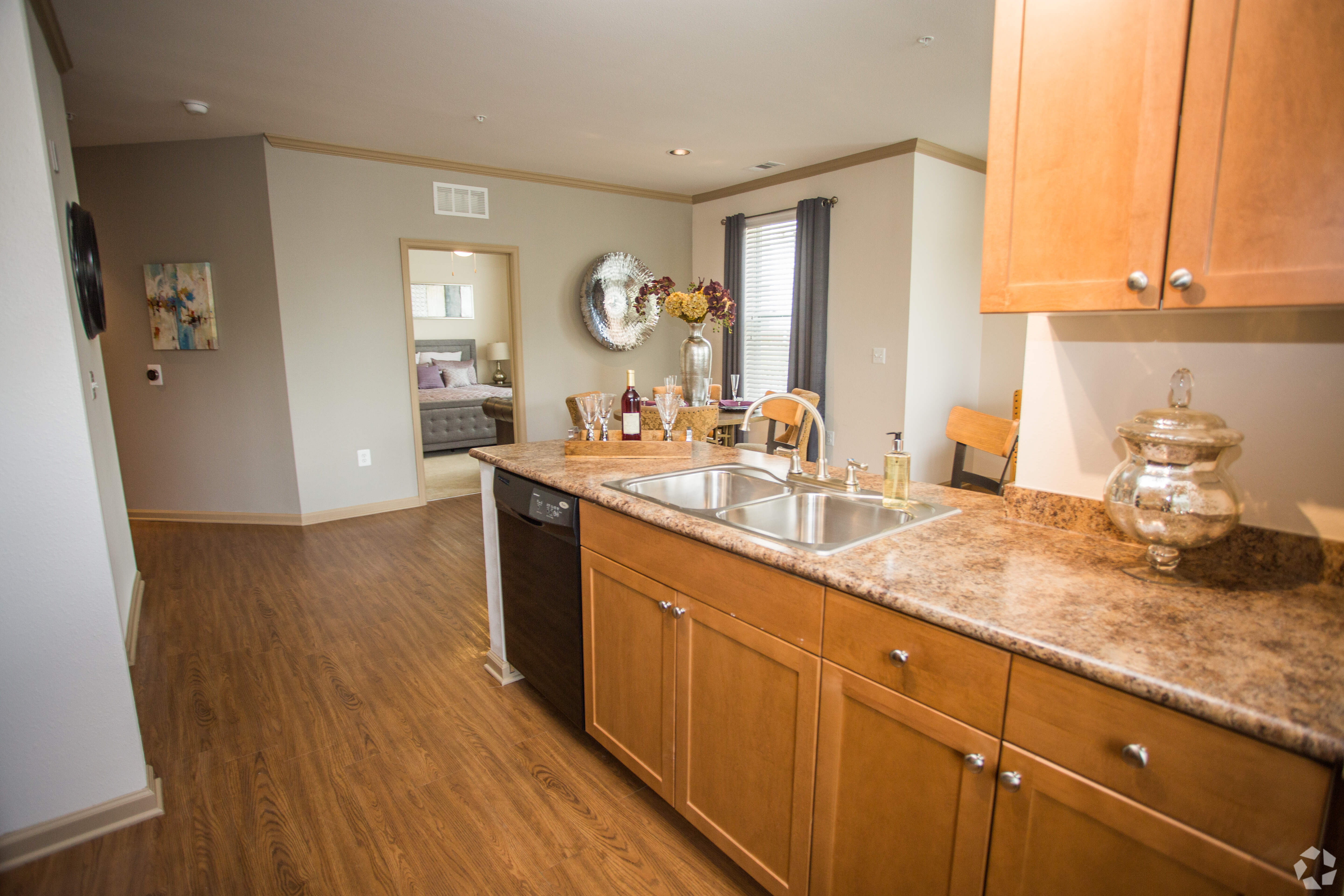 Model kitchen with wood cabinets at Summerfield at Morgan Metro in Hyattsville, Maryland