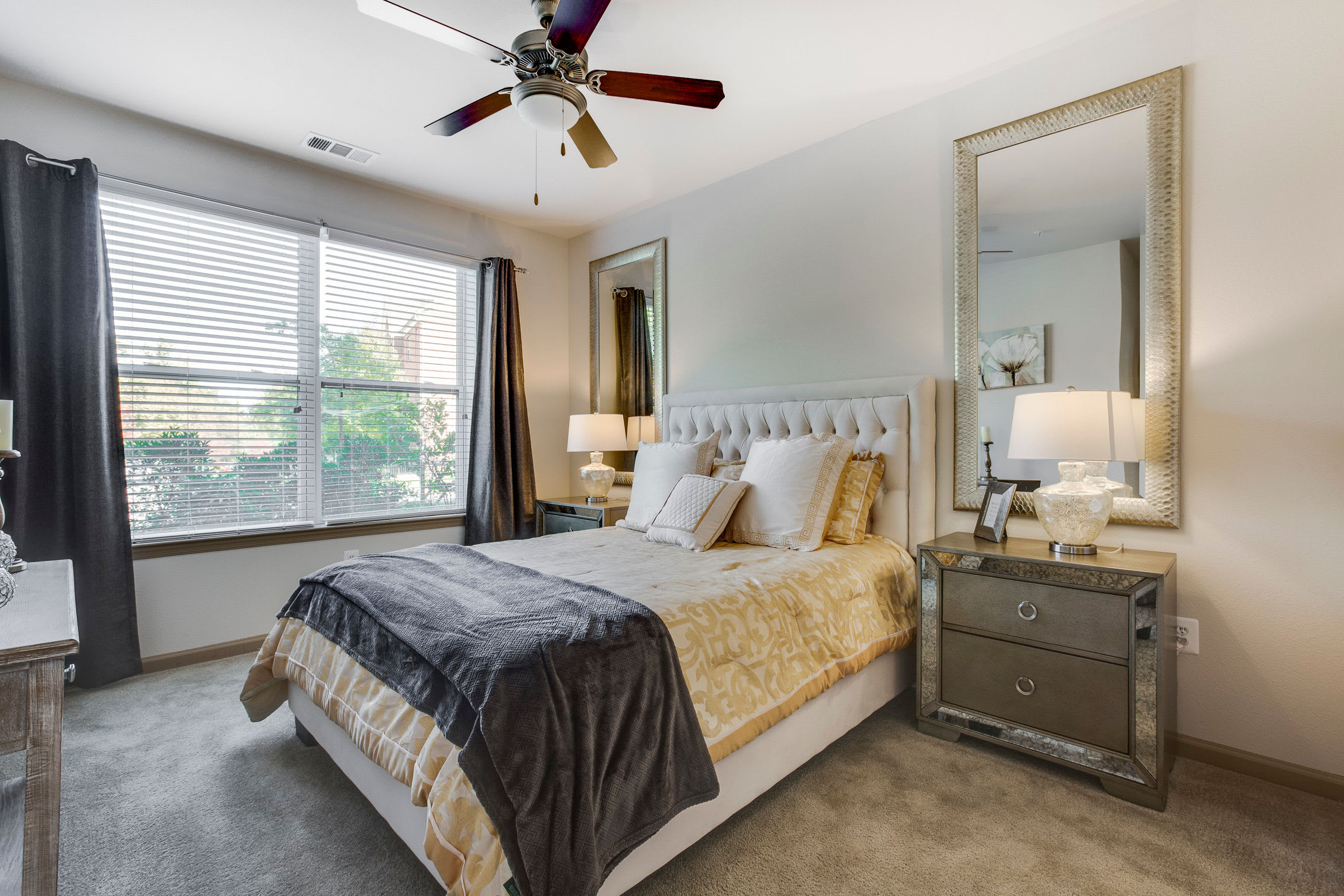 Model bedroom with a ceiling fan at Summerfield at Morgan Metro in Hyattsville, Maryland