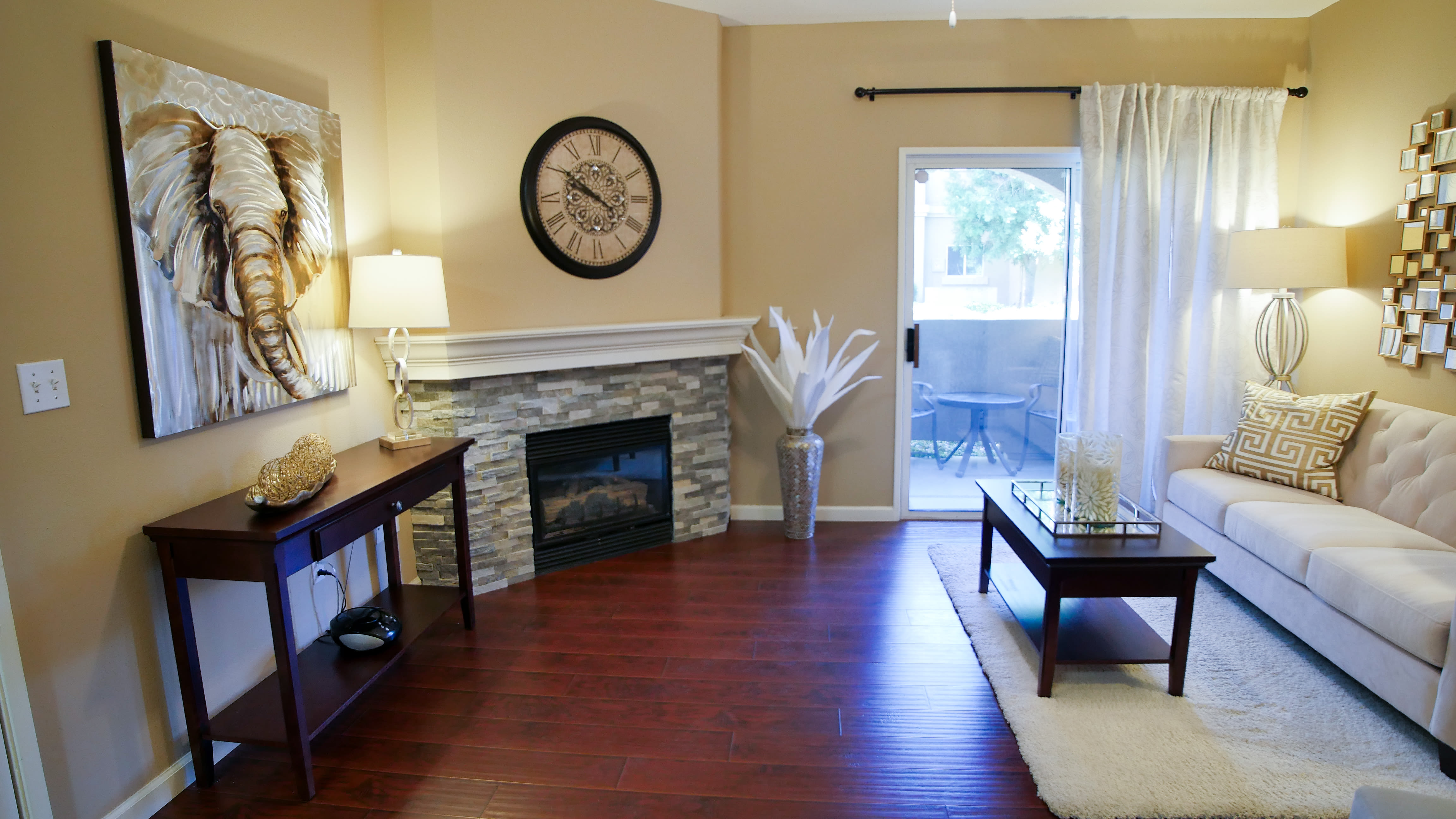 Living room with a fireplace at Vineyard Gate Apartments in Roseville, California