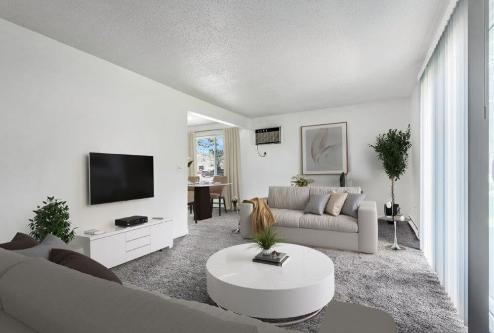 Model living room at Crossroads Apartments & Townhomes in Spencerport, New York.
