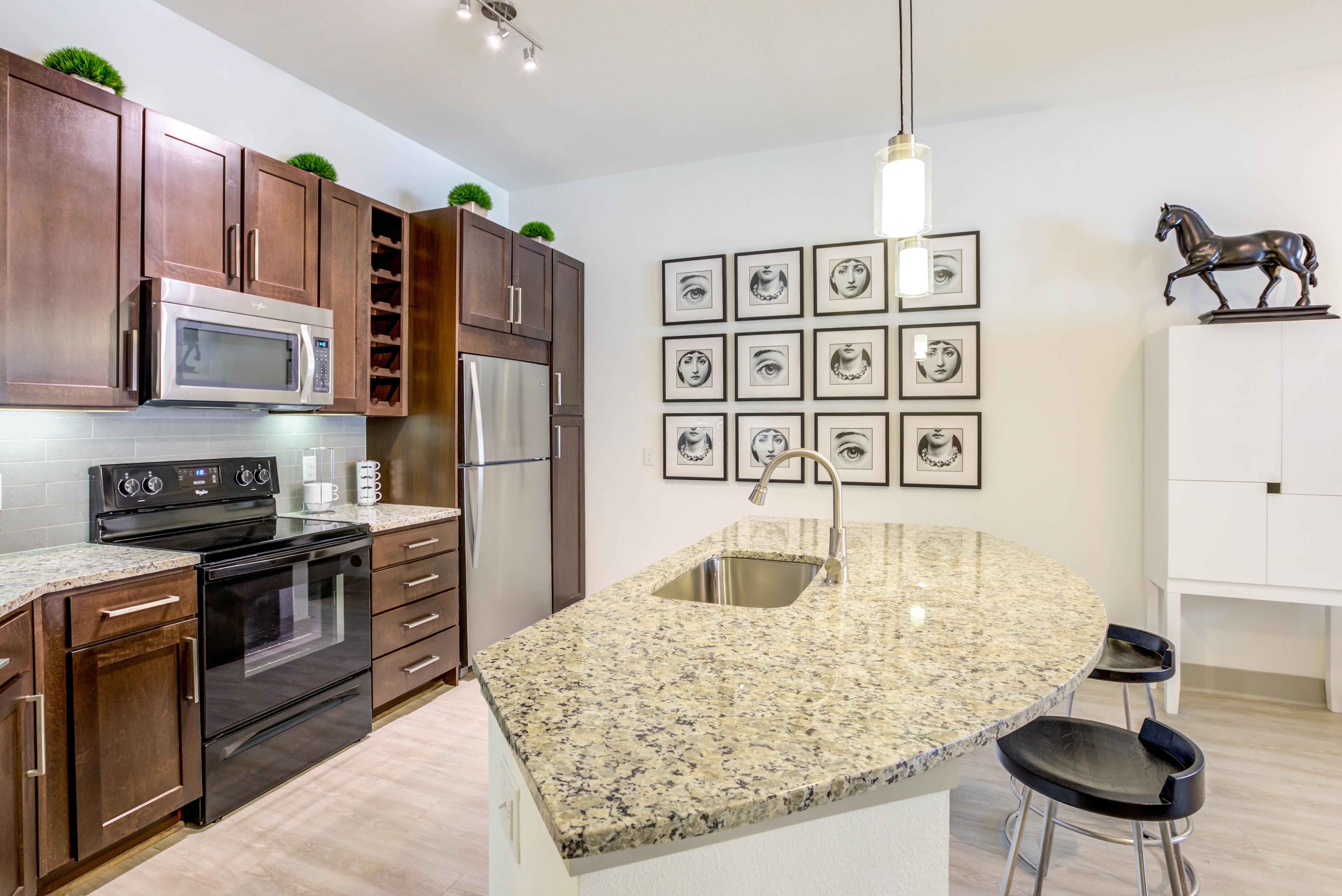 Kitchen with island at Helios in Englewood, Colorado