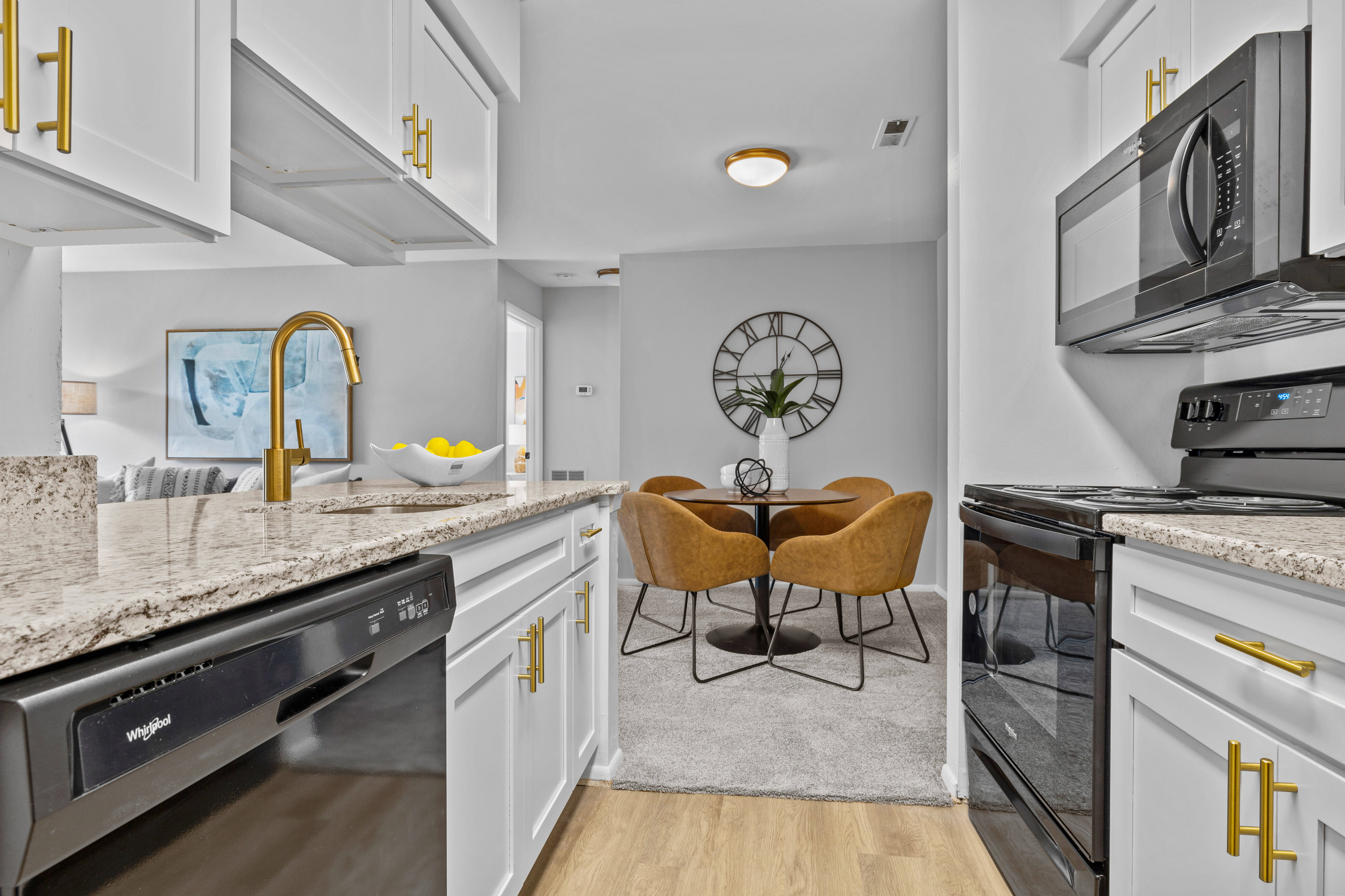 Model kitchen leading into the dining room at Runaway Bay Apartments in Virginia Beach, Virginia