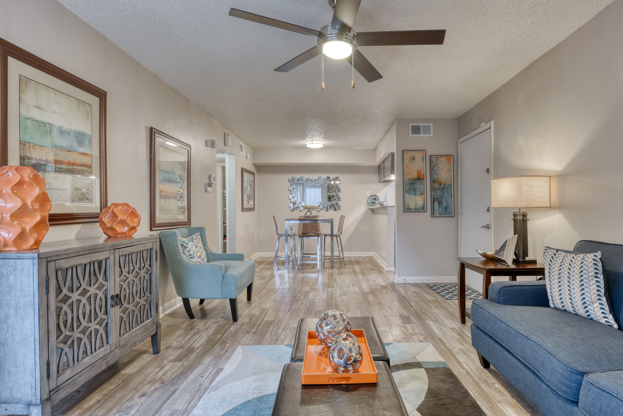 Furnished living area in an apartment at Villas de Santa Fe in San Antonio, Texas