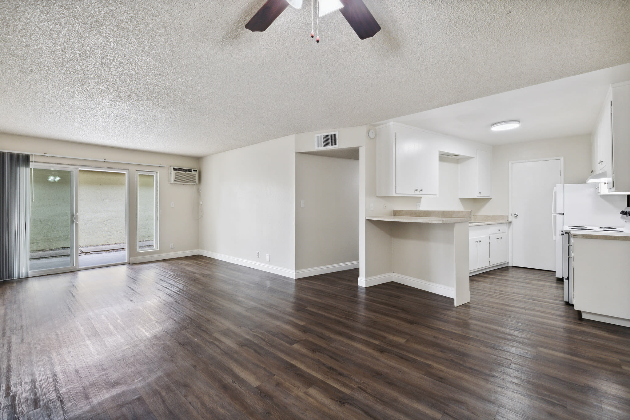 Hardwood flooring throughout living room at Coronado Apartments in Fremont, California