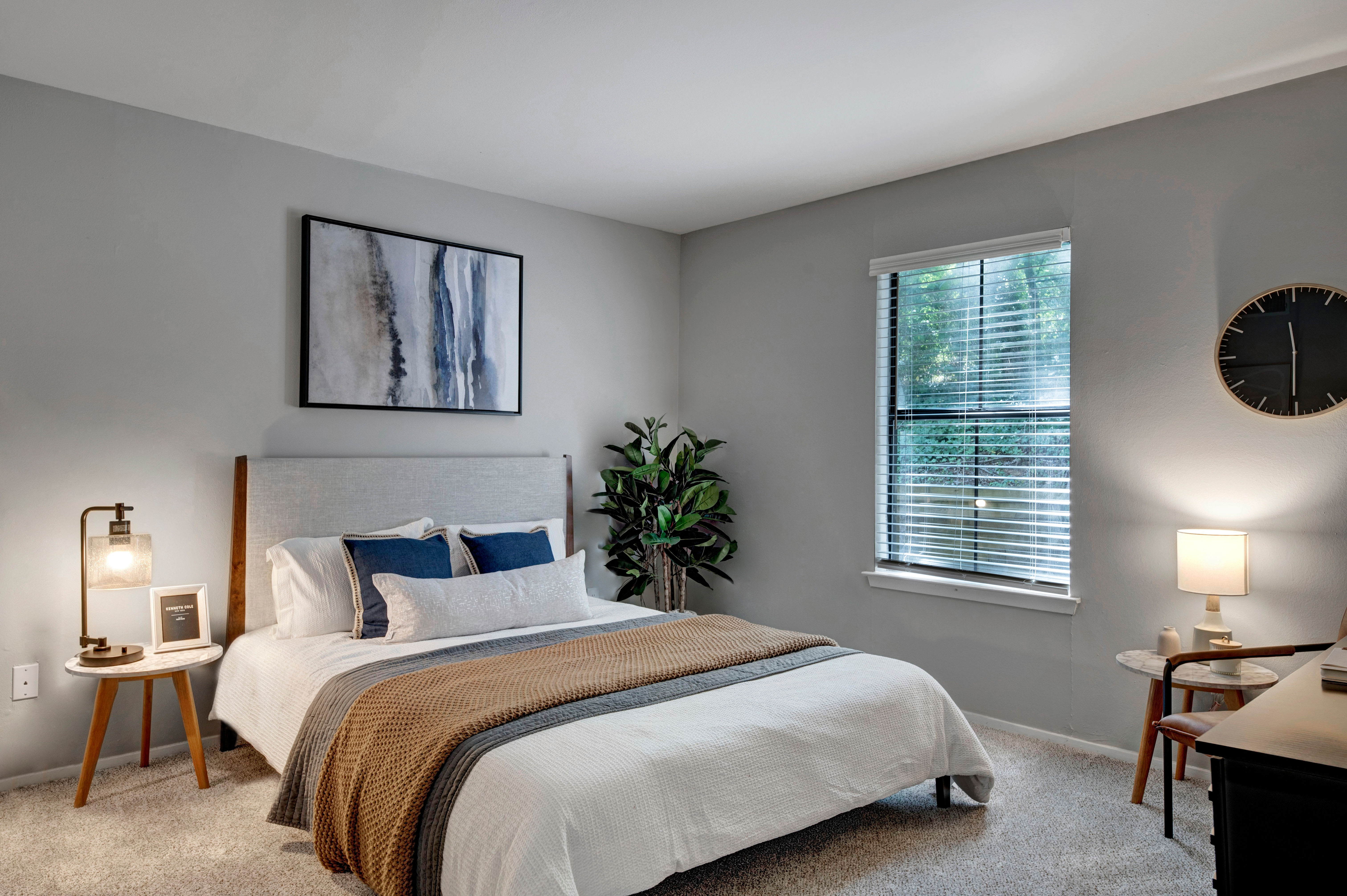 Beautiful model bedroom with hardwood style flooring at Emerald Place in Durham, North Carolina