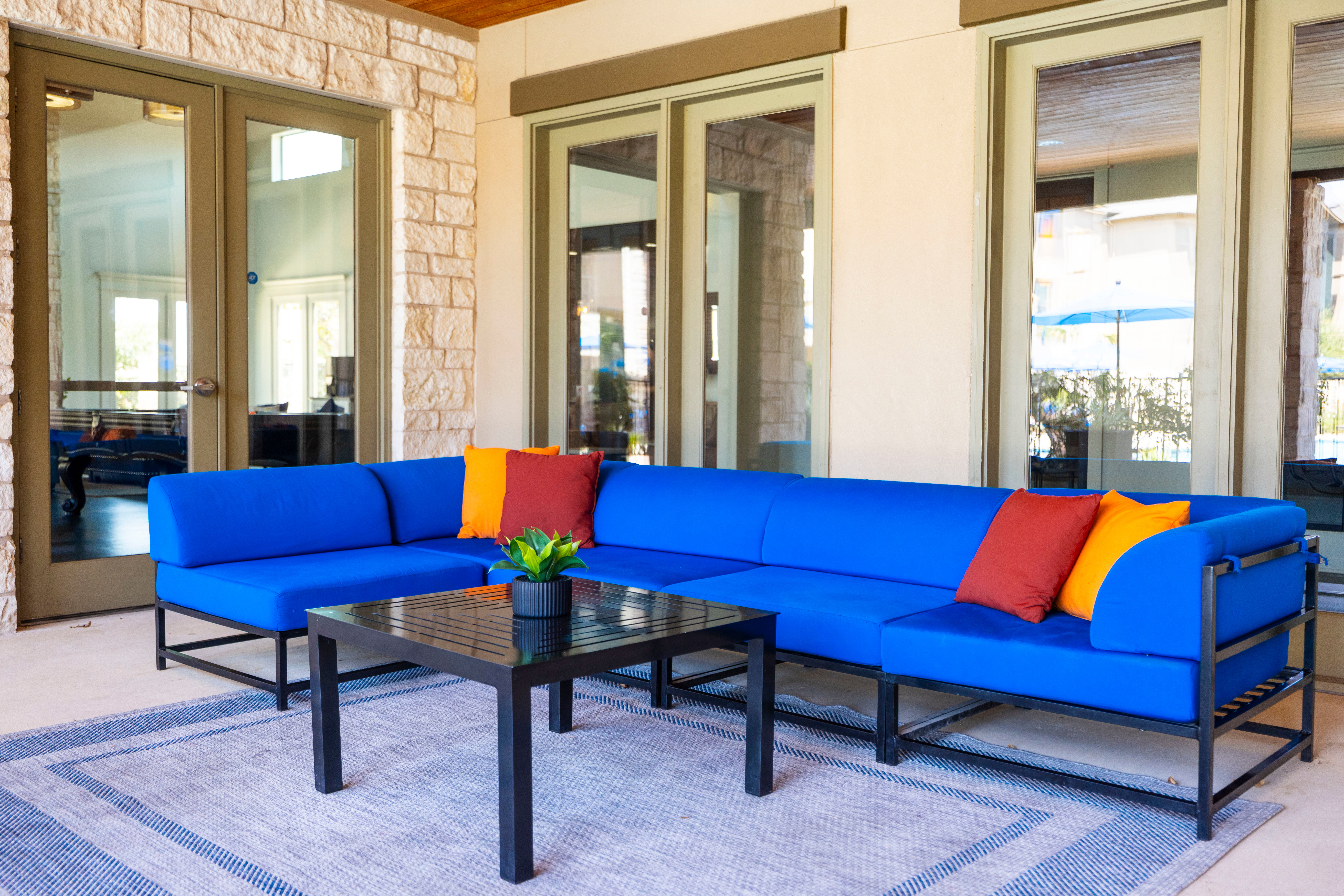 Covered outdoor lounge area at Carrington Oaks in Buda, Texas