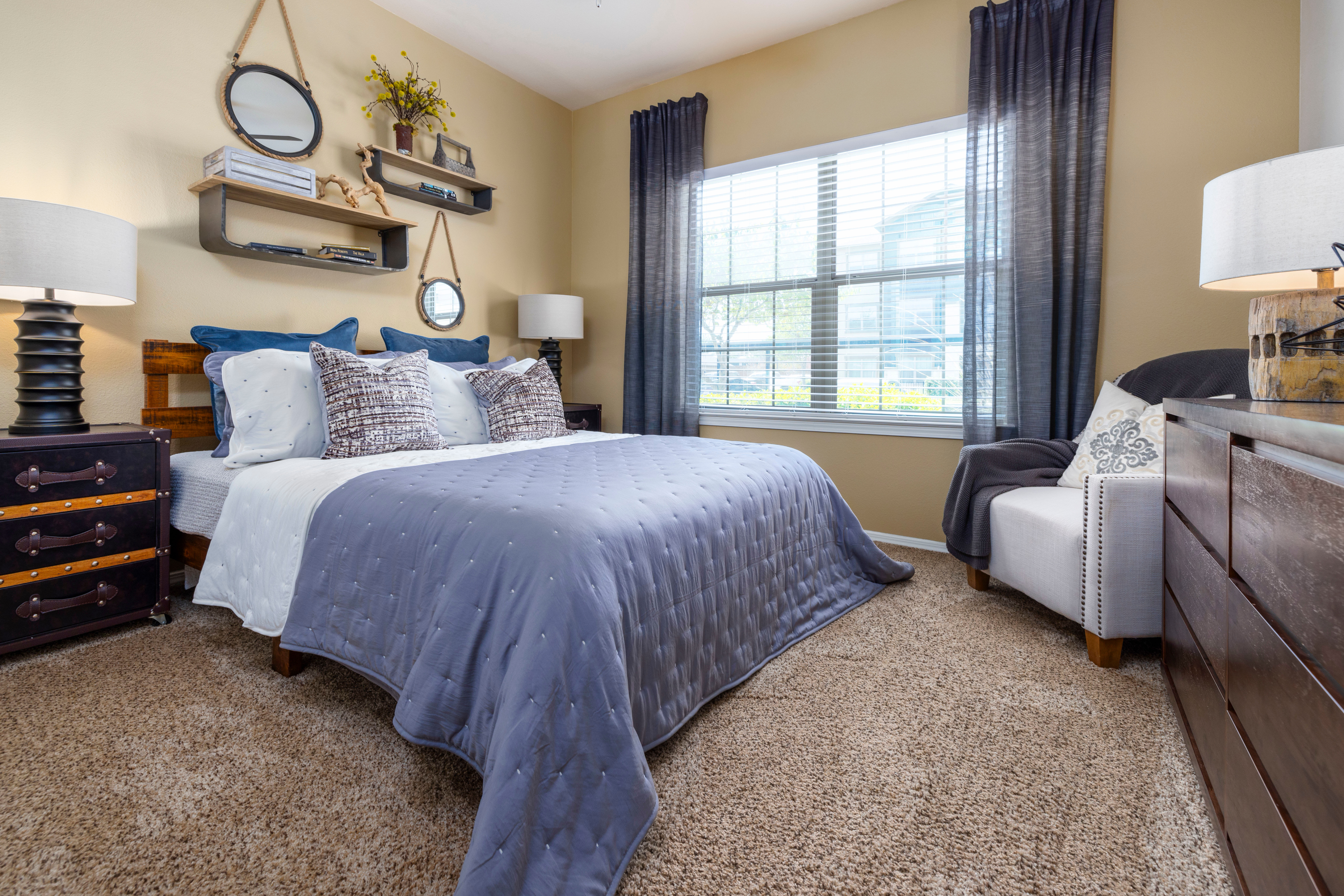 Bedroom of a model apartment home at Carrington Oaks in Buda, Texas