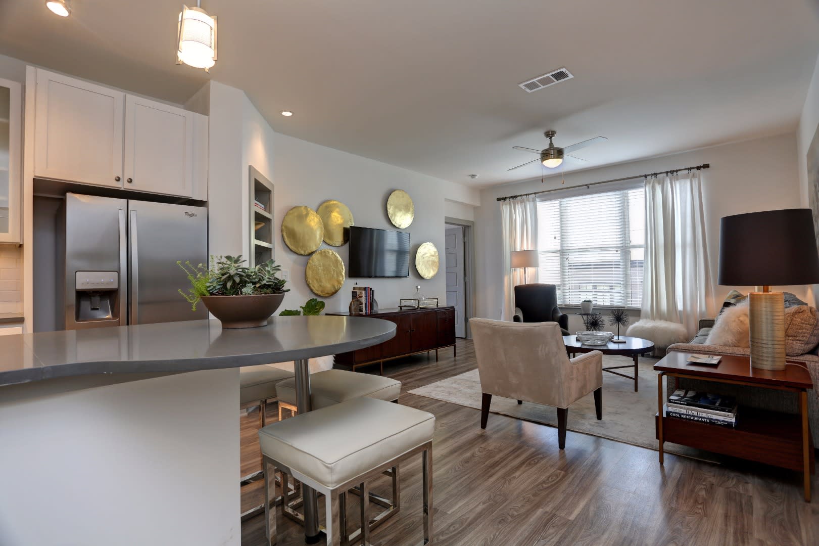 A large, spacious living room at Haven at Avalon in Alpharetta, Georgia.