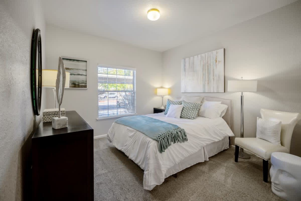 Comfortable bedroom at Oak Brook Apartments in Rancho Cordova, California