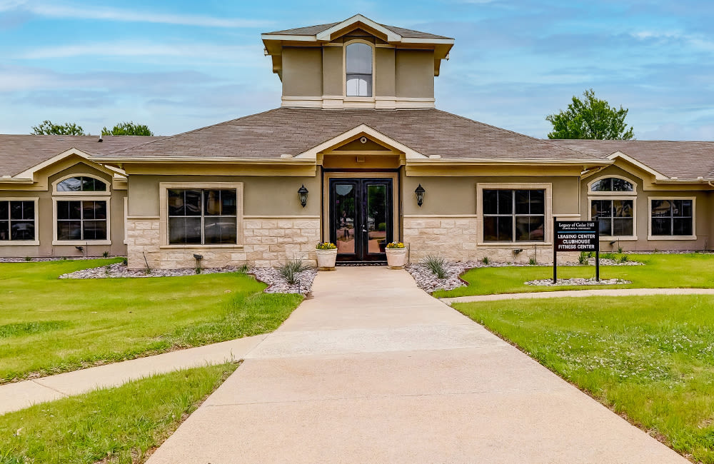 Leasing office exterior at Legacy of Cedar Hill Apartments & Townhomes in Cedar Hill, Texas.