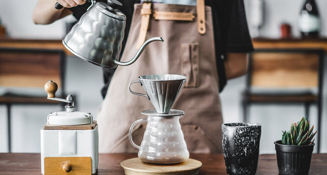 Barista pouring coffee at Creekside Apartment Homes in Fort Worth, Texas