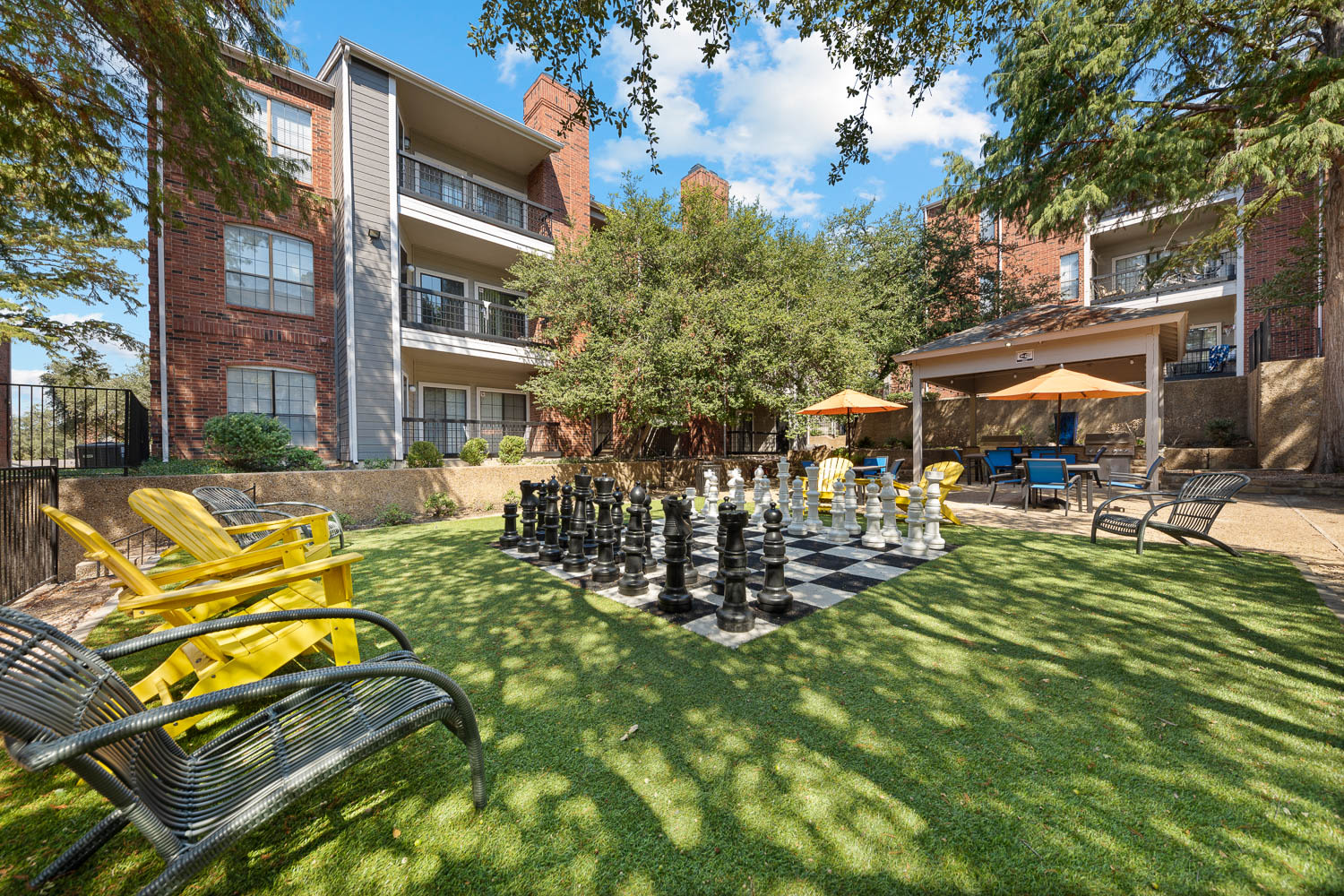 Giant chess and outdoor grilling and picnic area at The Brandt in Irving, Texas
