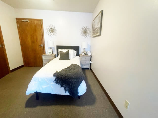 Spacious resident bedroom at Reflections at Garden Place in Columbia, Illinois. 