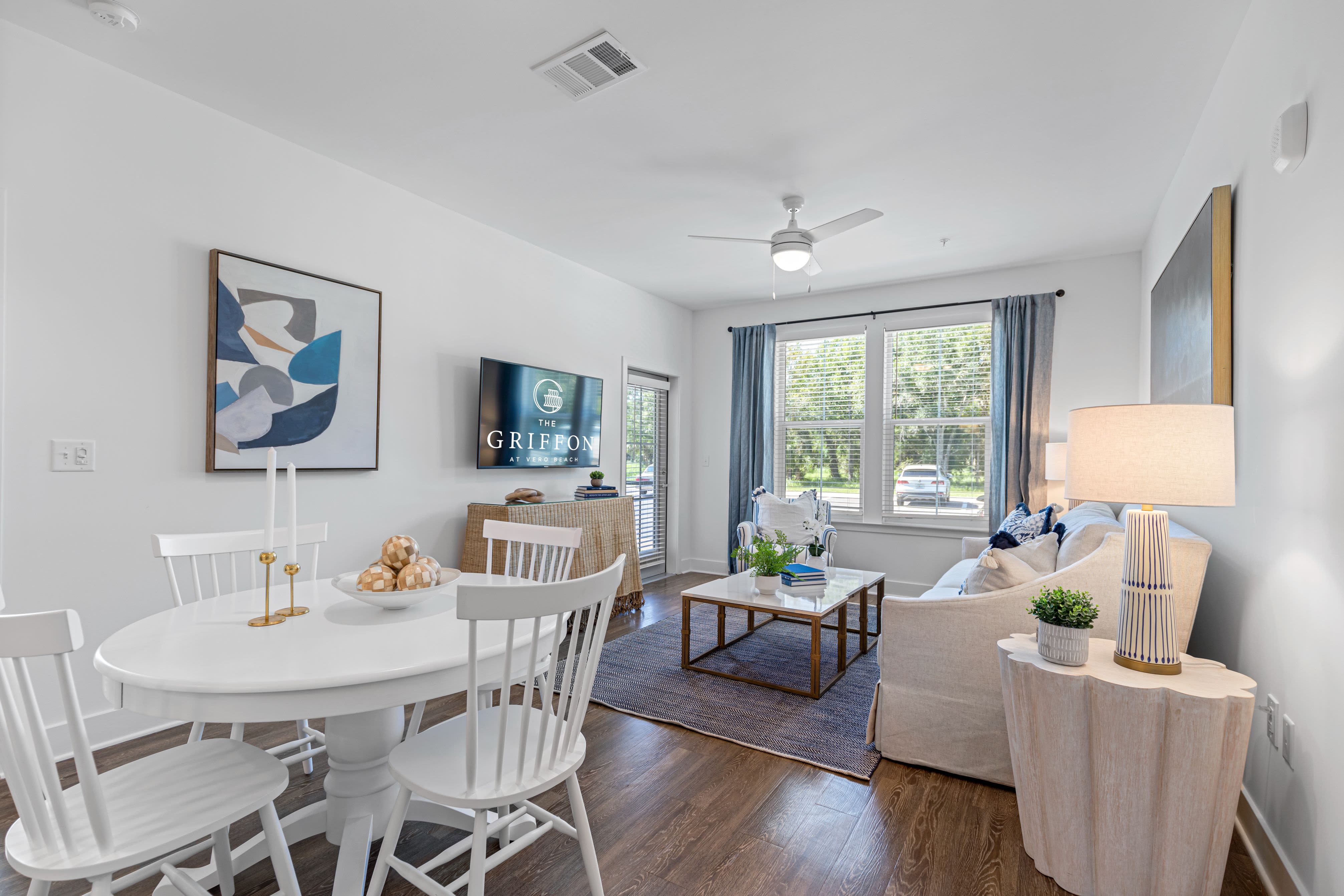 Spacious living room and a dining table at The Griffon Vero Beach in Vero Beach, Florida