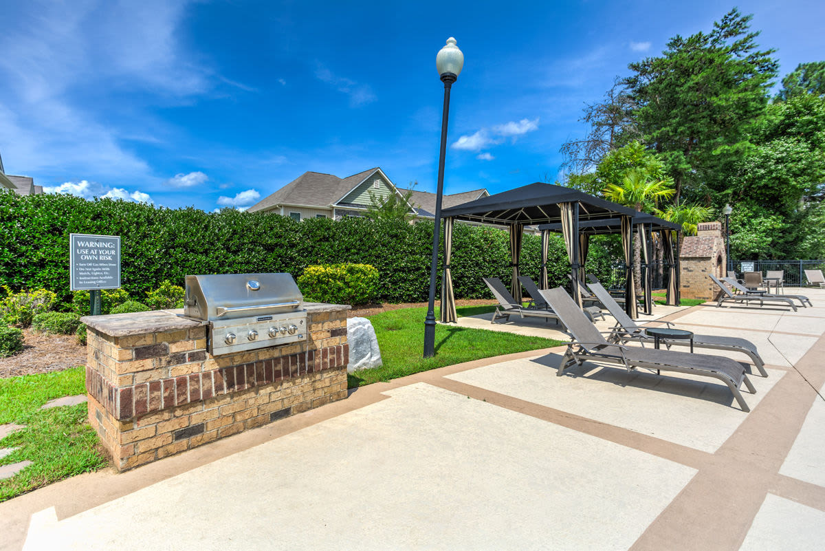Grilling area by the pool at Hayleigh Village in Greensboro, North Carolina