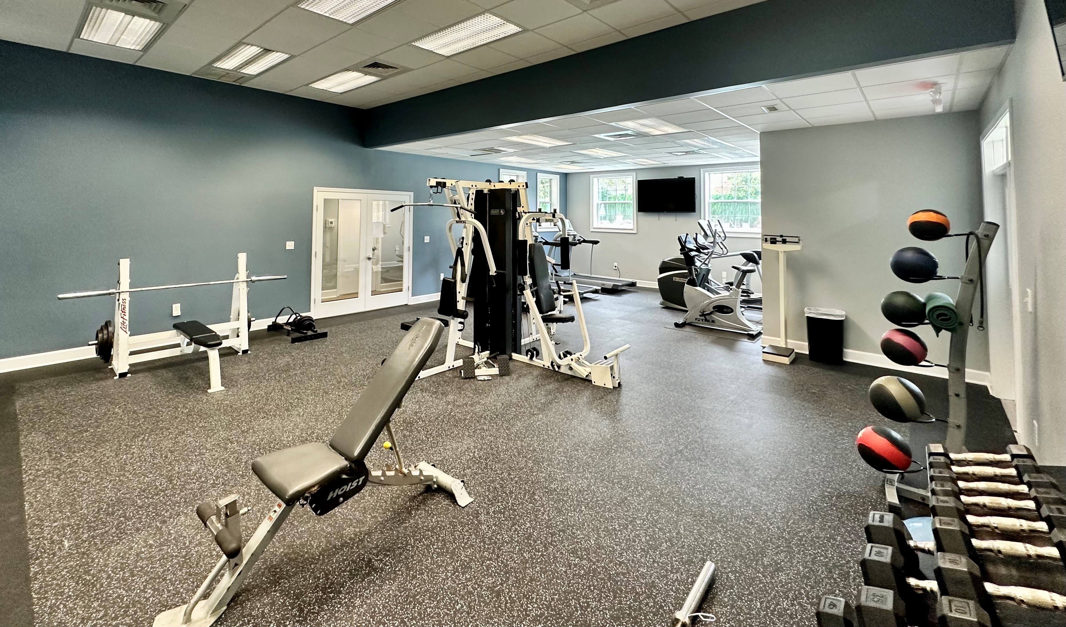 Fitness center with individual workout-stations at Glade Creek Apartments in Roanoke, Virginia