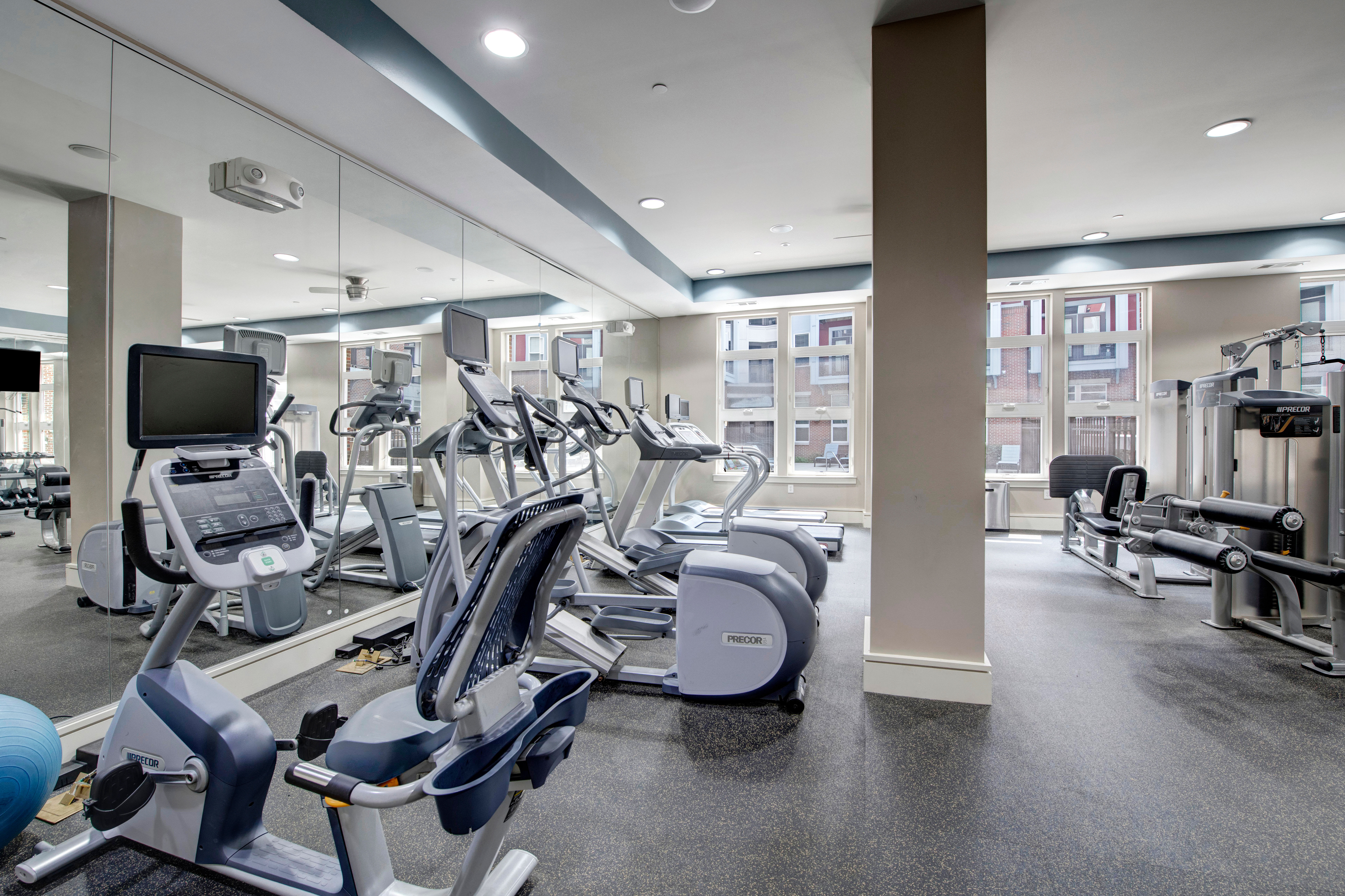 Resident running in the fitness center at Palette at Arts District in Hyattsville, Maryland