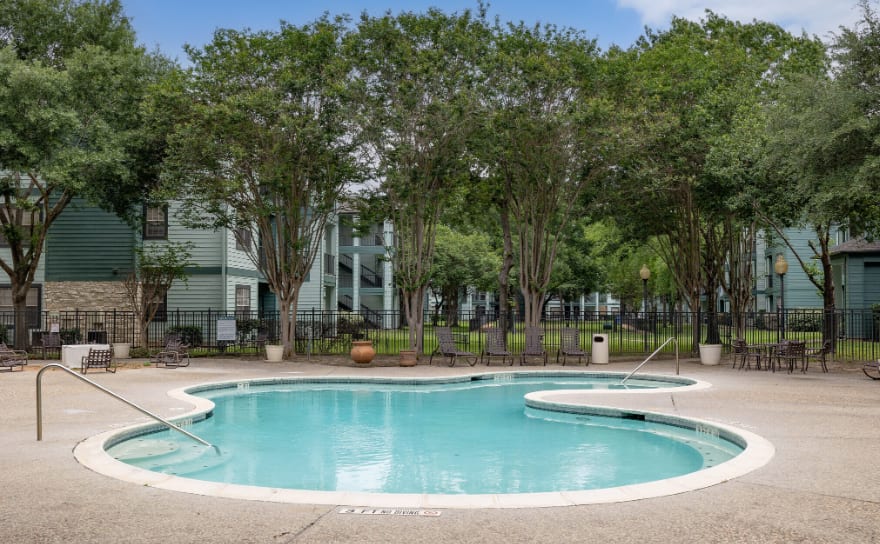 Welcoming pool with lounge chairs at Legacy at Cypress in Cypress, Texas
