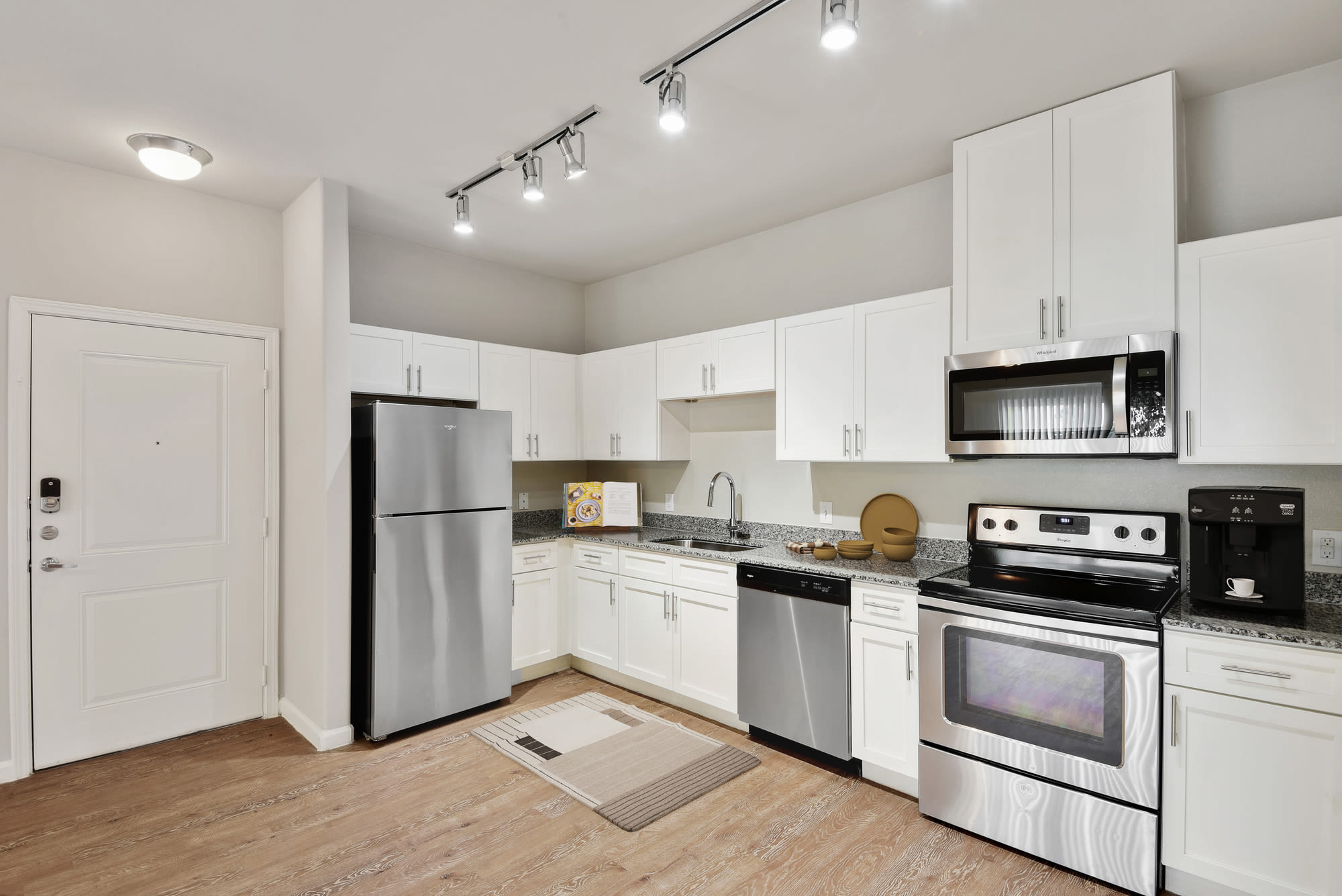Modern kitchen with stainless-steel appliances at Lantower Edgewater in Pflugerville, Texas