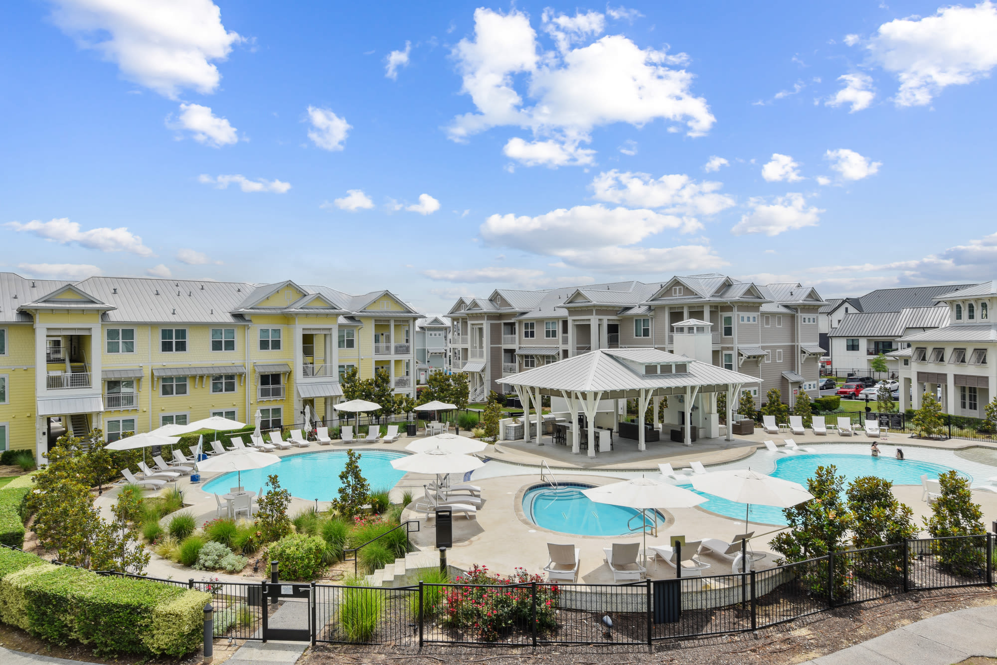 Aerial view of property with pools at Lantower Edgewater in Pflugerville, Texas