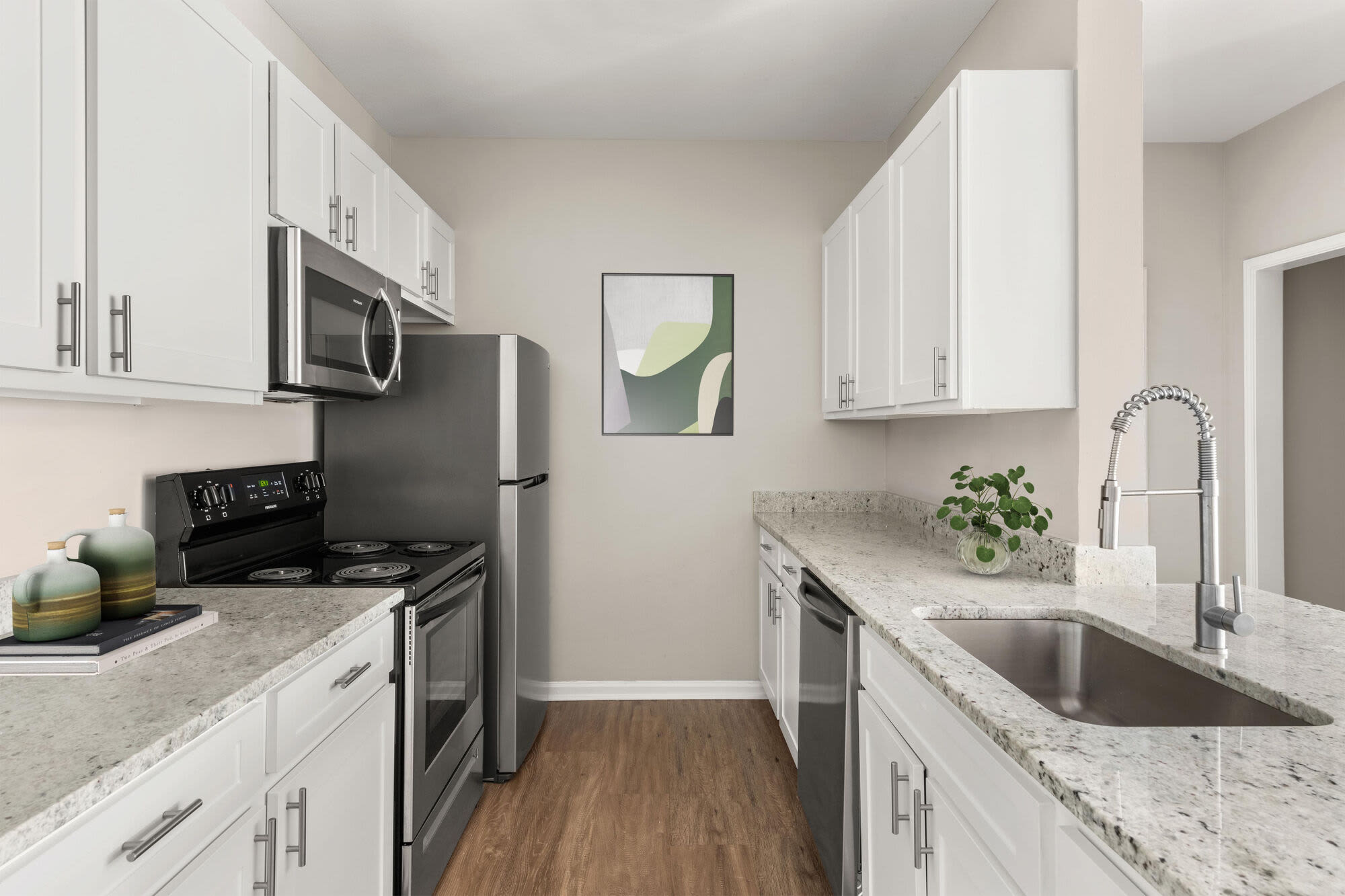 Spacious Kitchen with refrigerator and sink at Arbor Place Apartments in Douglasville, Georgia